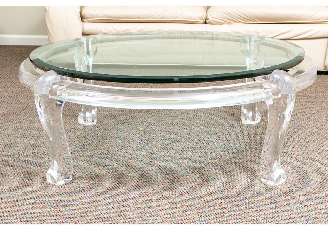 The Lucite base with four heavy cabriole legs. The thick convex-edge beveled glass top “Floats” above the frame when inserted.
Diam. 46 1/2