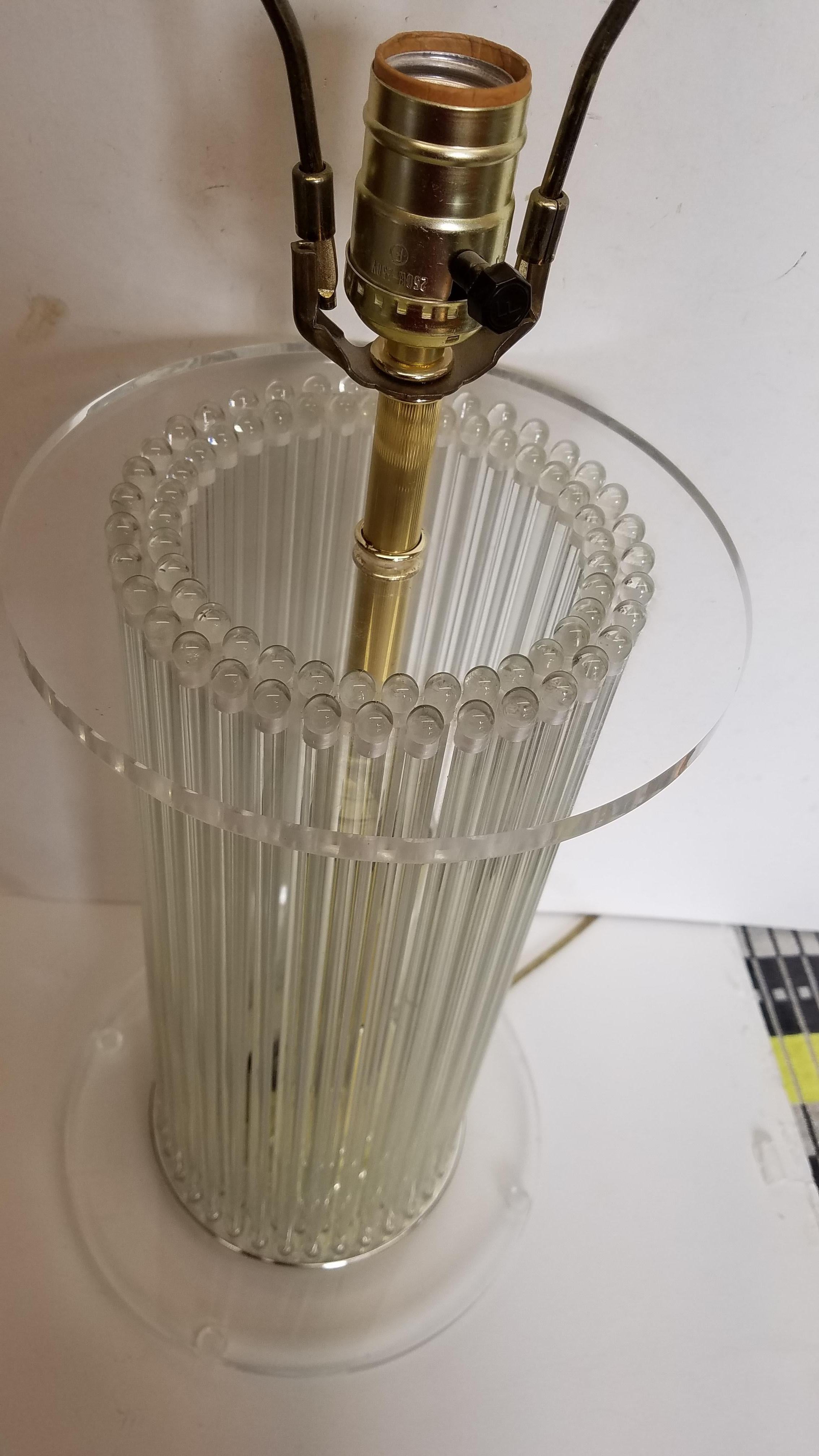 A glass rod and Lucite lamp that lights 3 ways, just the top socket, the base has 2 lights and you can light the base only at both the top and base. Attributed to Gaetano Sciolari. 20 inches to the top of the socket, add height for a shade.