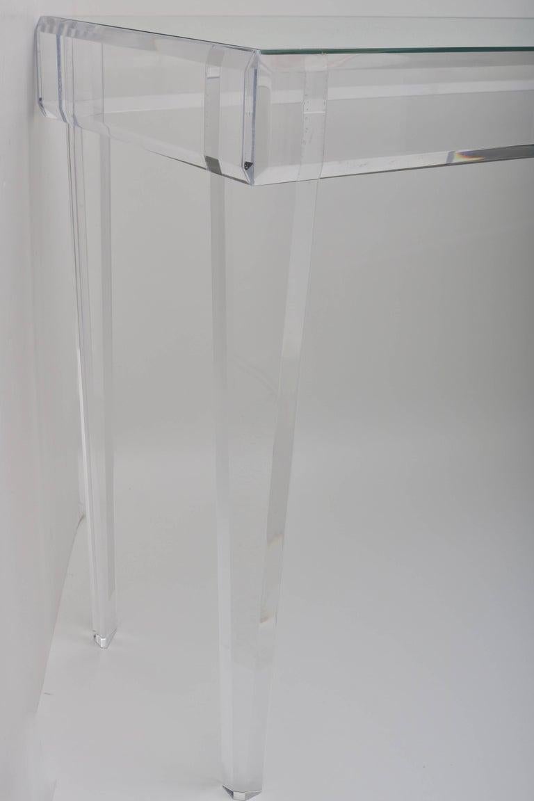 This stylish and chic clean-lined lucite and mirror console table is a custom design for the Iconic Snob Galeries Lucite Collection fabricated by our workroom. 

Modern Lucite and Mirror Console Table 60