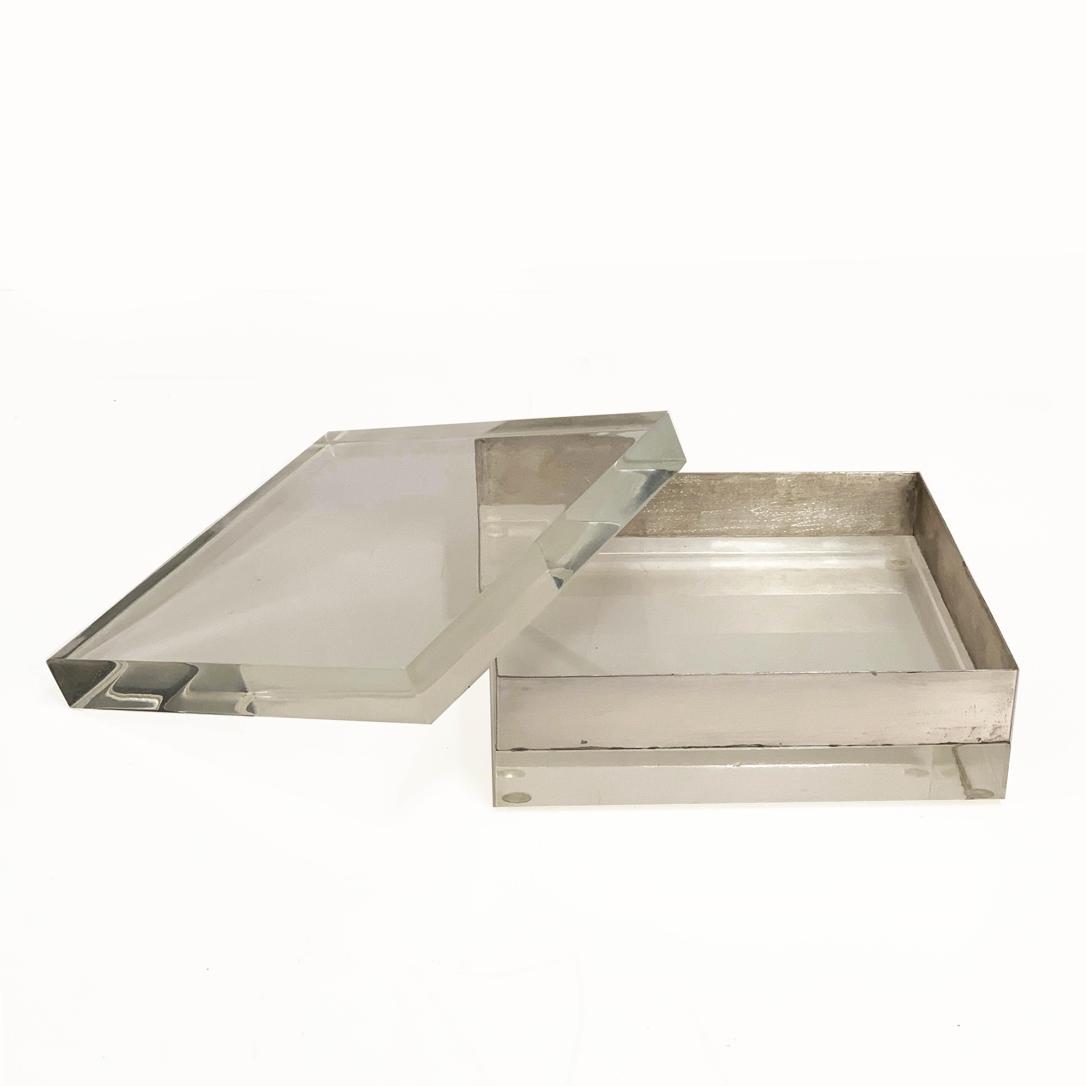 Amazing Lucite and silver squared decorative box. This item was designed in the 1970s.

This piece is made of a crystal Lucite and silver with a crystal Lucite removable top, the way this item reflect the light is just magnificent and makes this