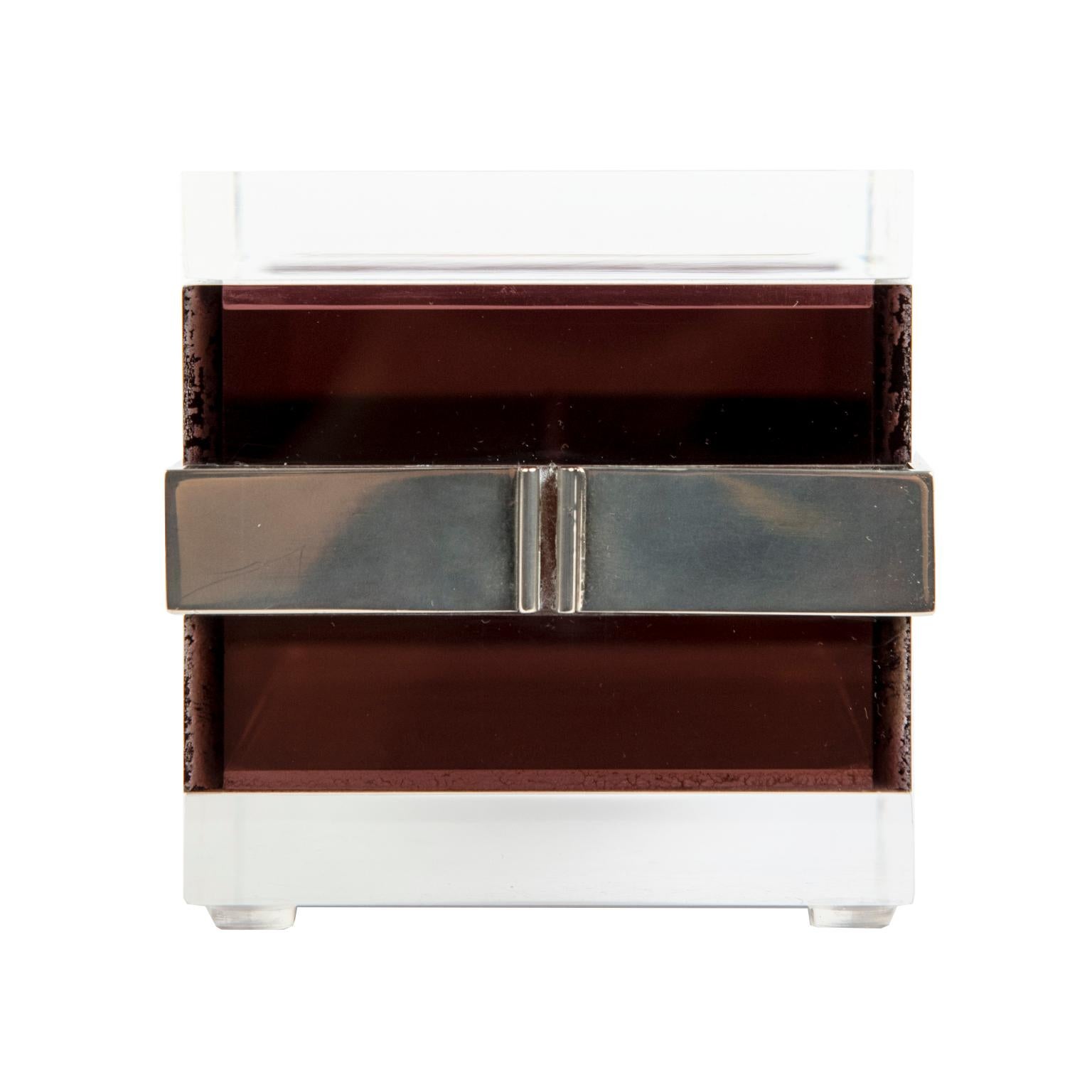 A clean and sophisticated acrylic box with clear top and bottom with layers of “chocolate” brown acrylic with a plated steel middle band.
Very good vintage condition!