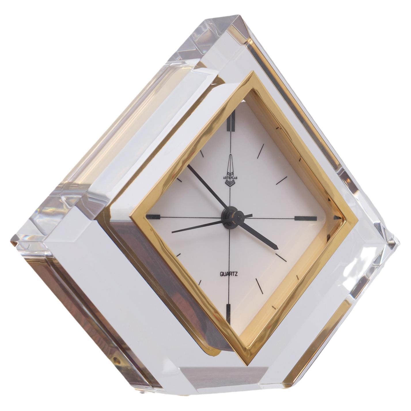 Very rare Lucite Triangle shaped table clock. Comes with a Quarts timepiece 
Manufactured by Arteplas Spain 1970s Good quality piece.
