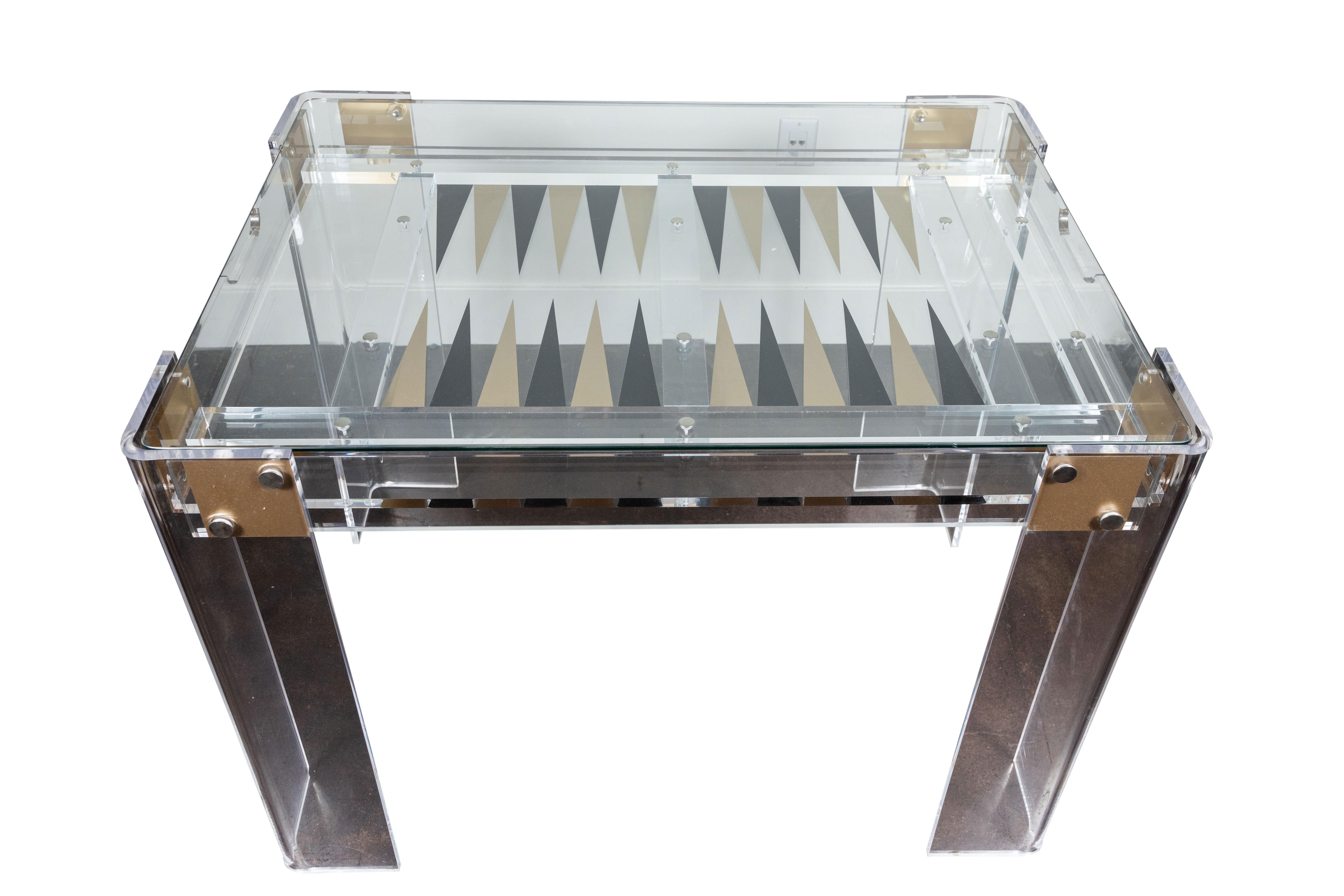 Chic Lucite backgammon table, circa 1980s in the manner of Charles Hollis Jones. Table has a removable glass top and could be used as a stunning desk or small dining table for two. Very good vintage condition.