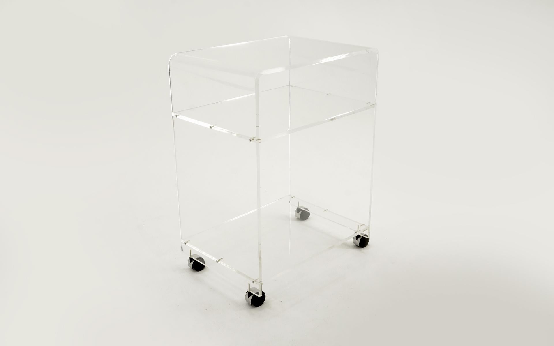 Acrylic / Lucite bar or serving cart. Rolls easily and is high quality construction with thick Lucite. Light scratches to the acrylic.