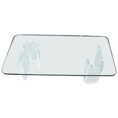 Tavolino rettangolare compatto con base in lucite e piano in vetro