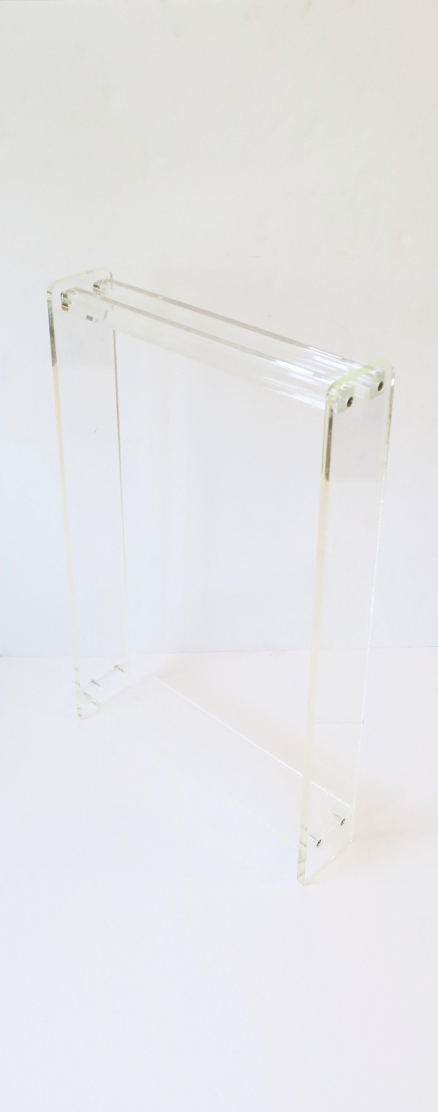 A Lucite bathroom towel rack or stand, circa late-20th century. Towel rods are 1