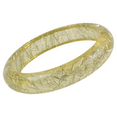 Bracelet jonc en lucite jaune citron avec inclusions de fils métalliques argentés