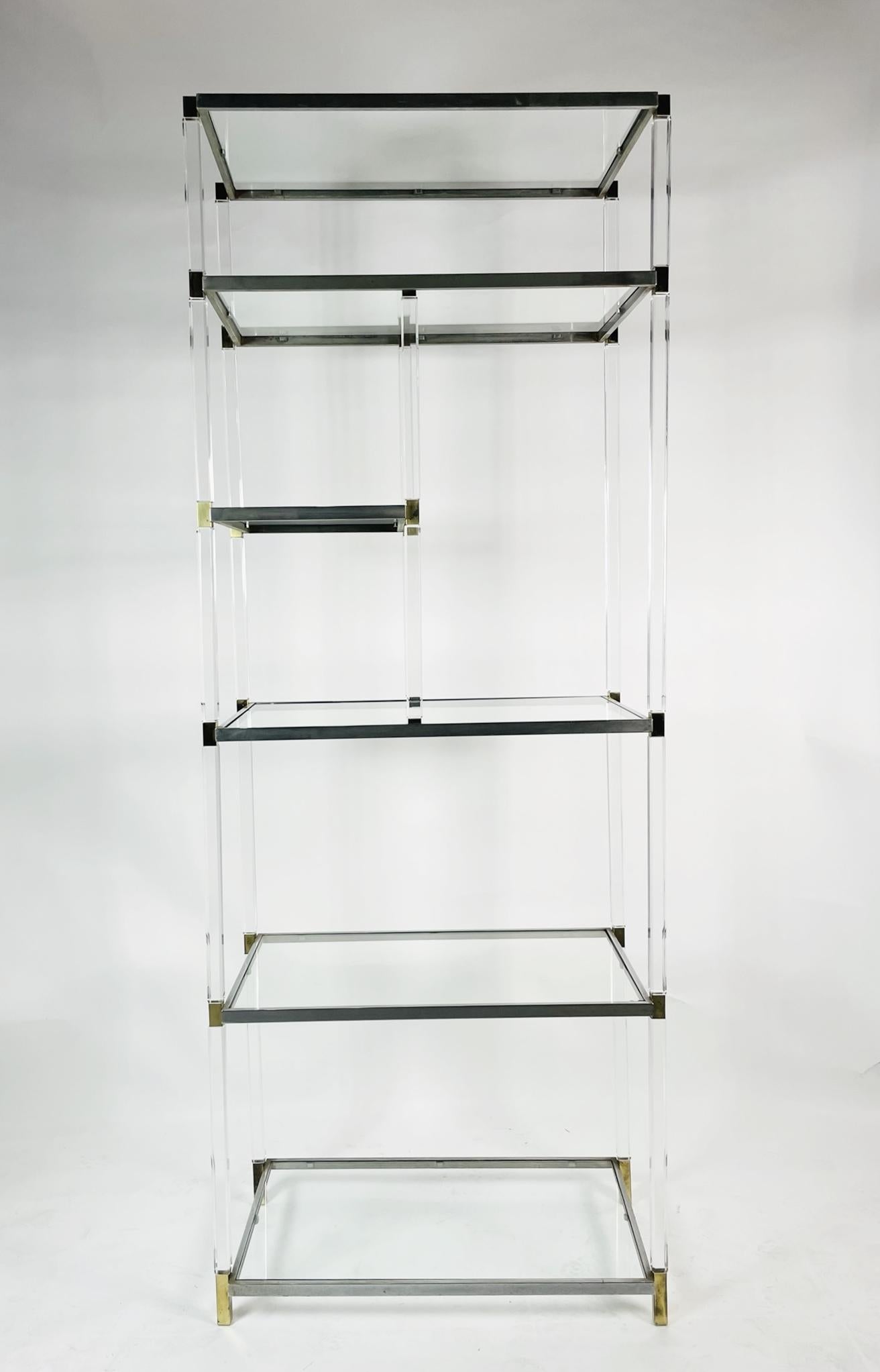 Stunning lucite, brass, nickel and glass display cabinet designed and manufactured by Charles Hollis Jones.

This cabinet was designed and manufactured in 1966 during his time with Hudson Rissman and it has not been in production since the late