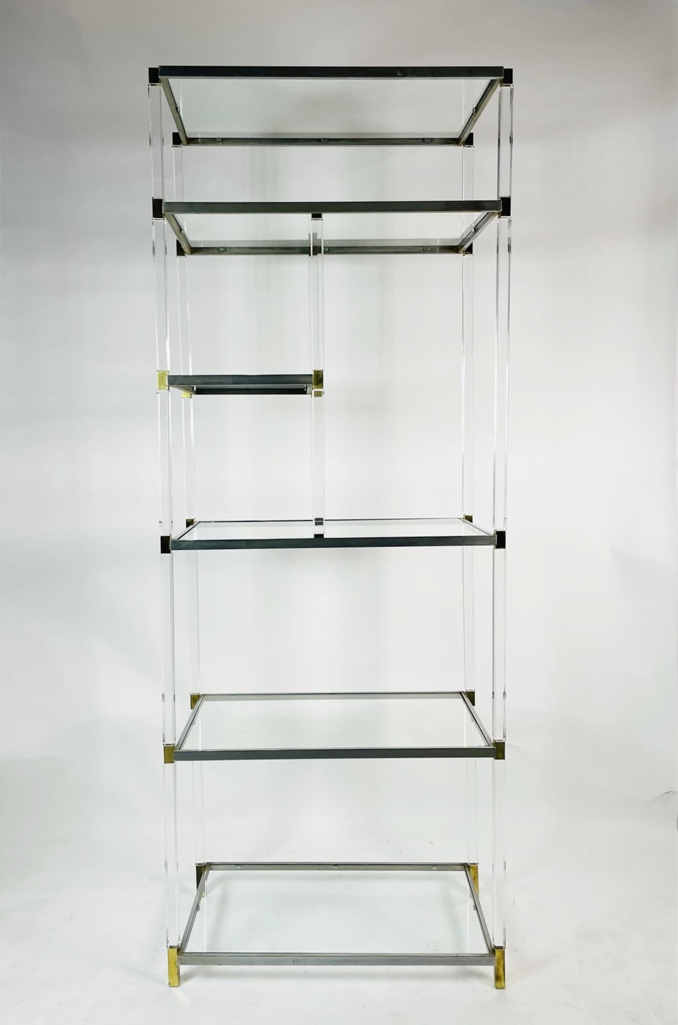 Stunning Lucite, brass, glass and nickel etagere/display cabinet designed and manufactured by Charles Hollis Jones.

This cabinet was designed and manufactured in 1966 during his time with Hudson Rissman and it has not been in production since the