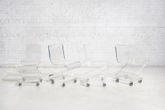 Lucite Chairs on Casters, circa 1970, Les Prismatiques