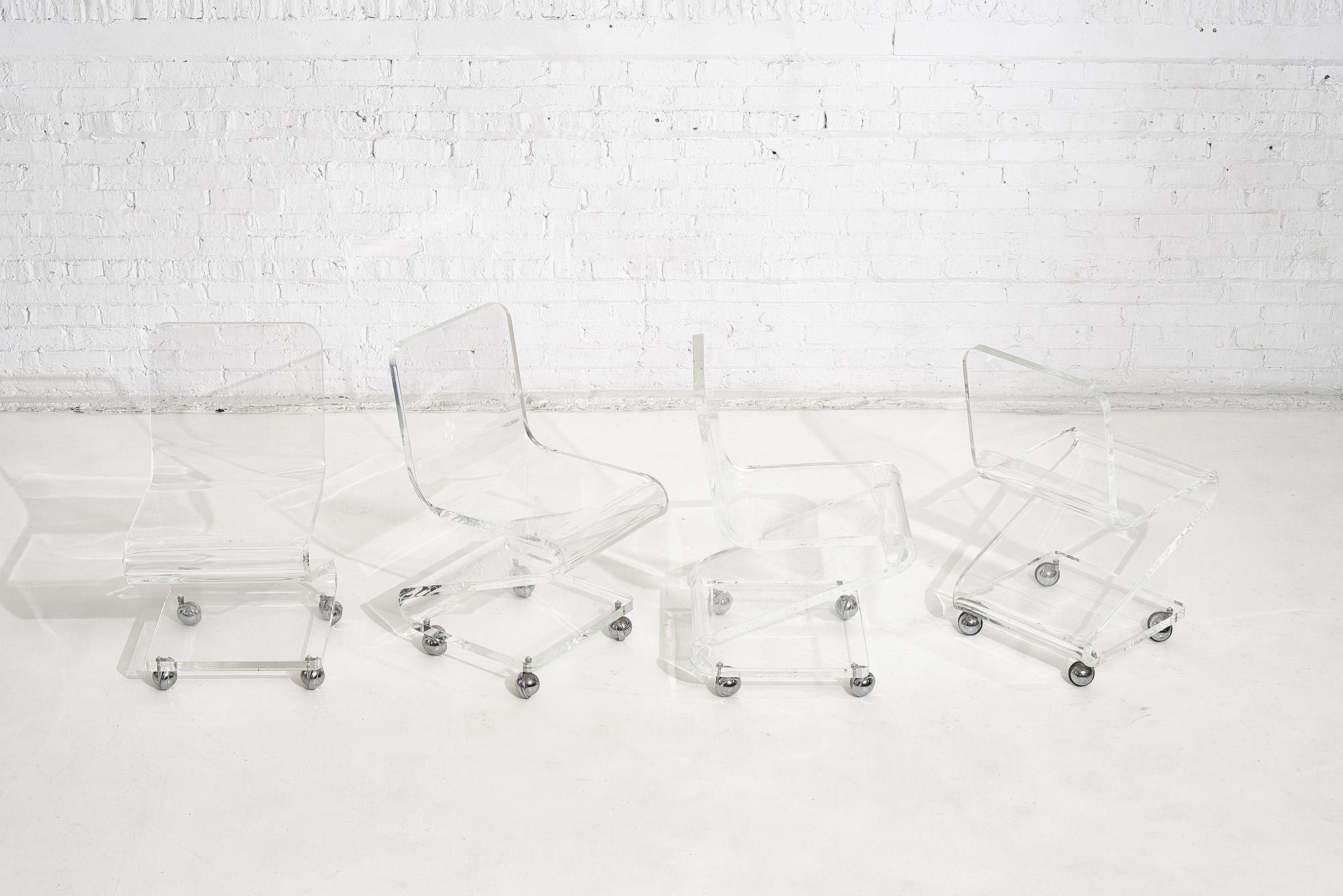 Mid-Century Modern Lucite Chairs on Casters, circa 1970, Les Prismatiques en vente