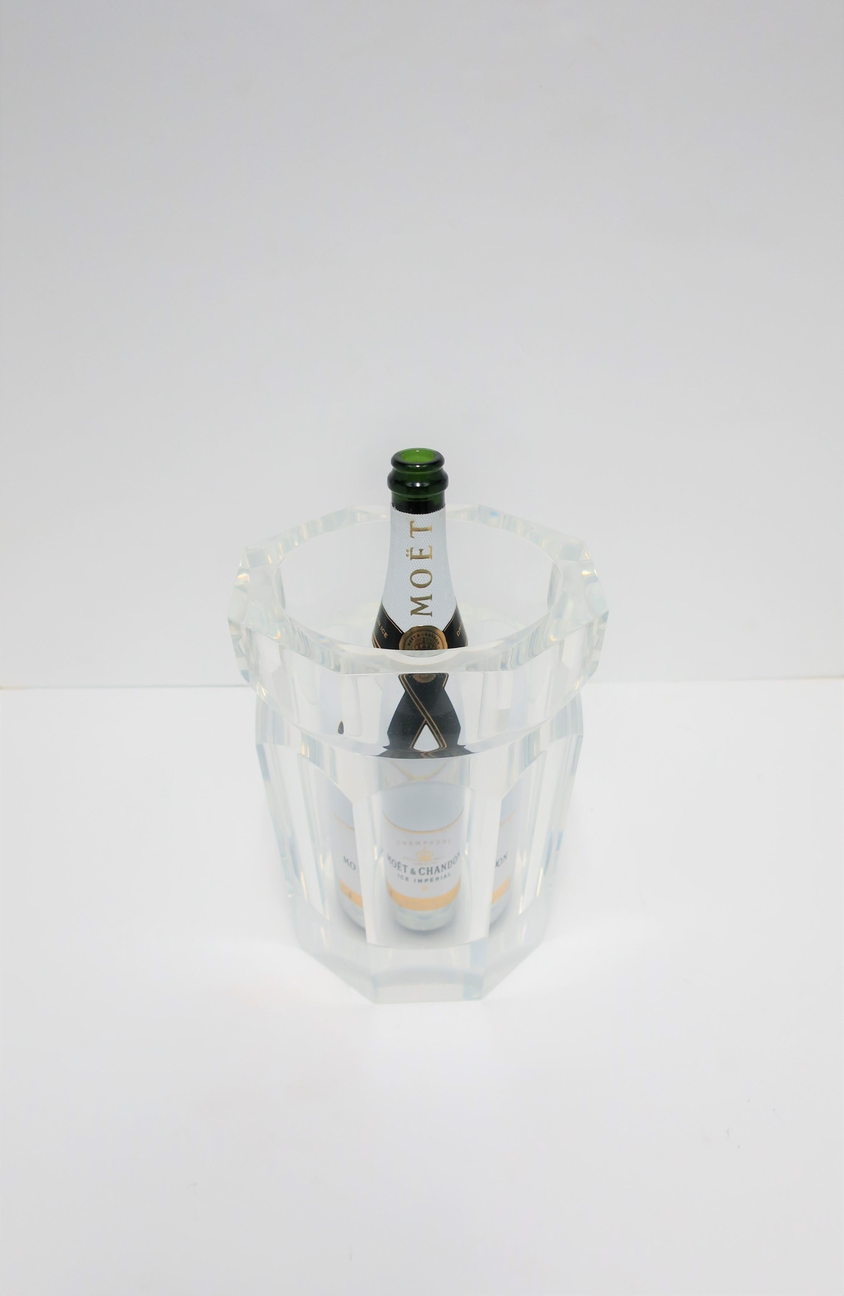 This is a very beautiful, substantial, and well made octagonal Lucite Champagne or wine cooler/holder or ice bucket, circa 1990s or later. Piece measures 1 inch thick or more. Shown with Champagne bottle in several images for size/perspective. A