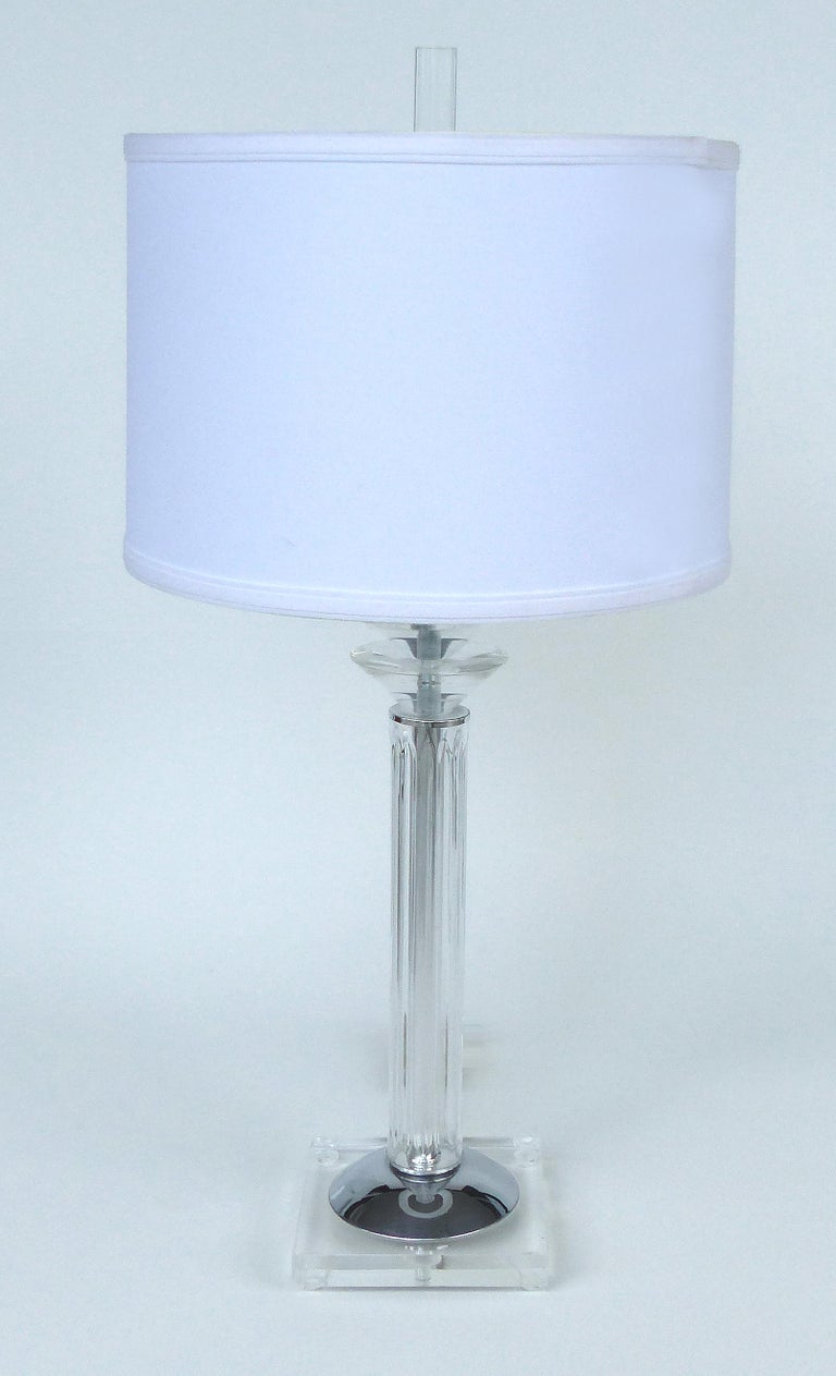 Bauer Lamp Company Lucite, Chrome and Glass Table Lamps, 1993

Offered for sale is a pair of Lucite, glass and chrome table lamps by the Bauer Lamp Company dated 1993. The lamps have their original linen drum shades and Lucite finials. Shades; 14.25