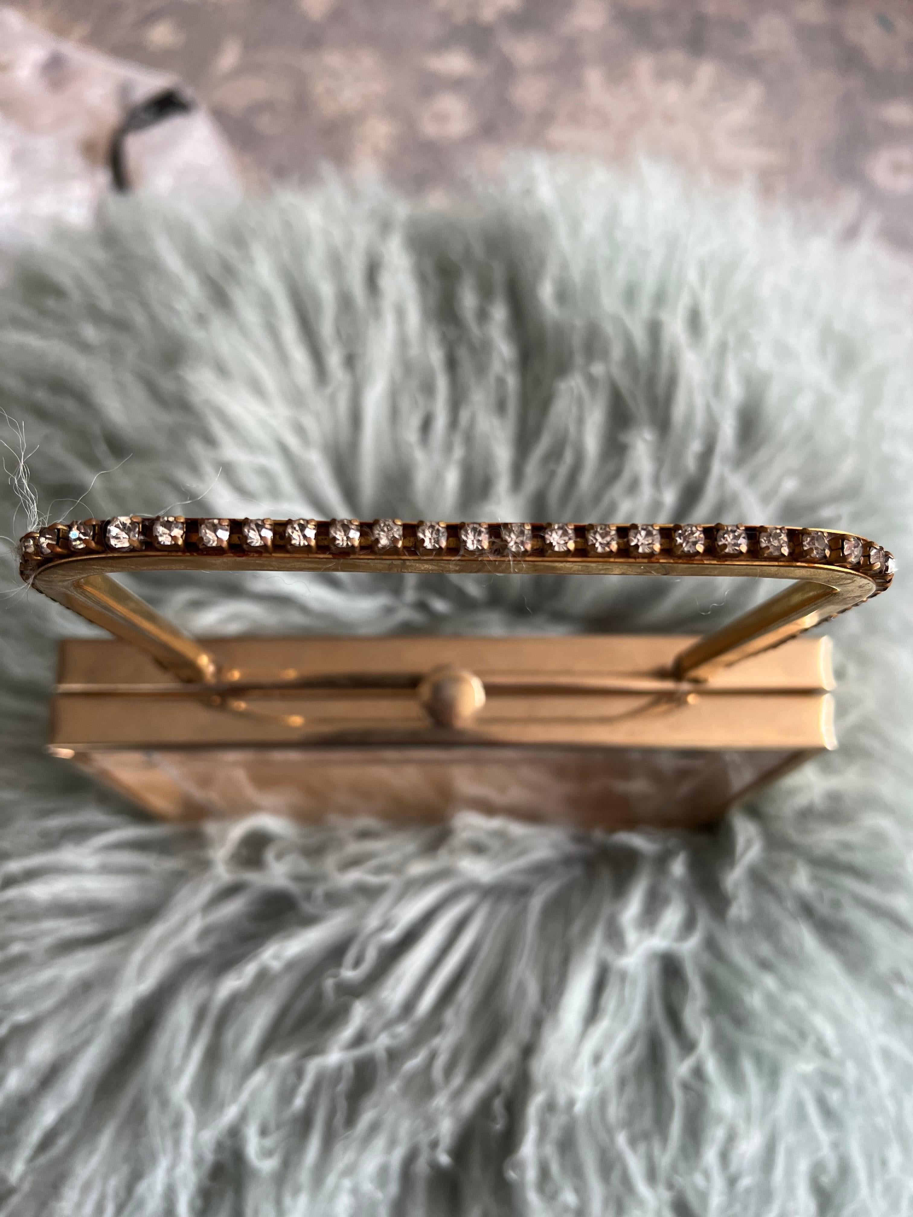 lucite clutch flyover New York with crystals 
Grace Kelly style. 
This is a rare lucite bag/clutch in mint condition. 
Embellished with crystals on the handles. 
Part of the New York 1950s flyover collection. 
More Elegant, Chic and Rare today. 
Can