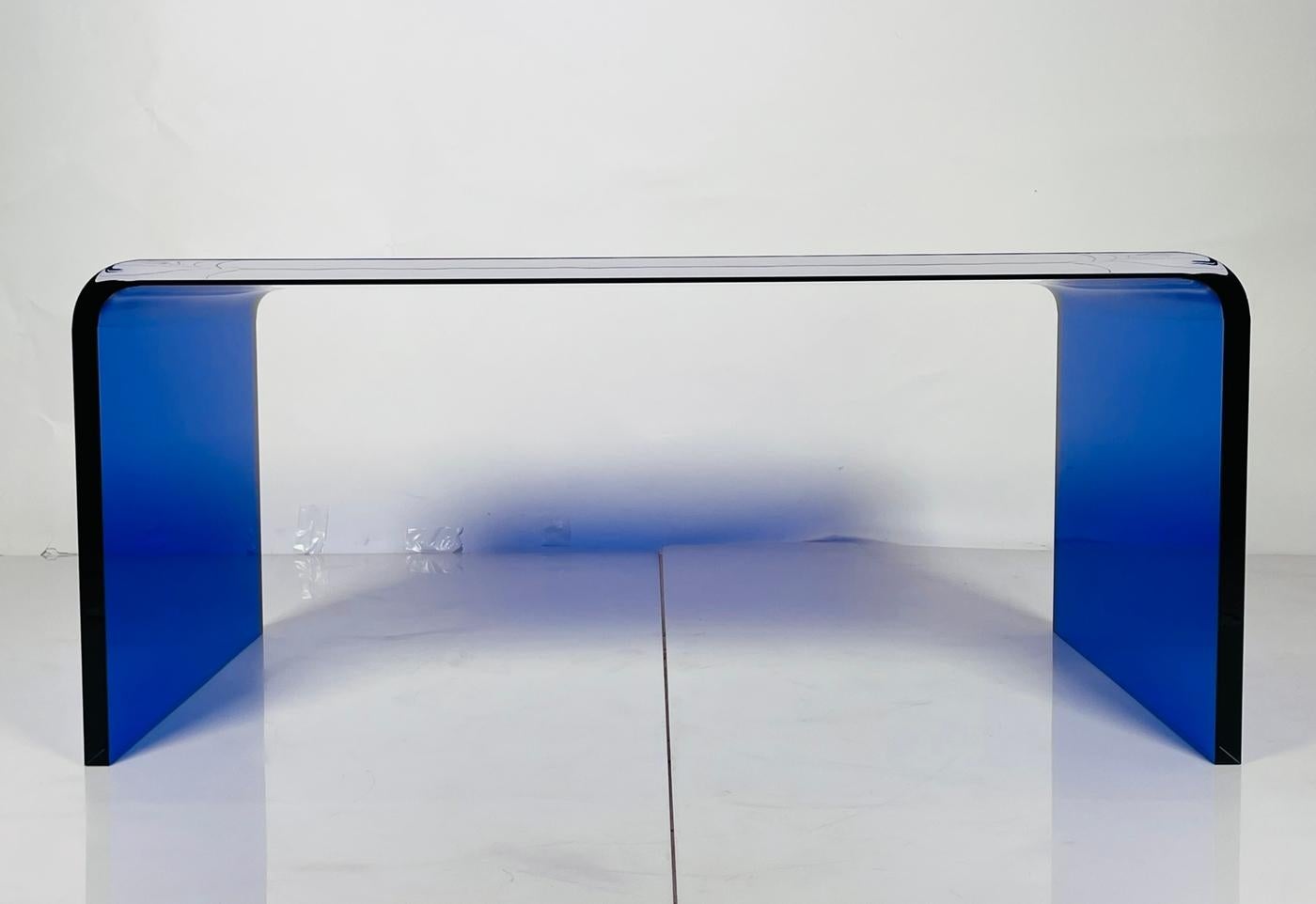 Introducing the stunning Lucite Coffee Table in Cobalt Blue by Cain Modern, USA 2023. This exquisite piece of furniture will add a touch of elegance and sophistication to your living space. Crafted from high-quality Lucite material, this coffee