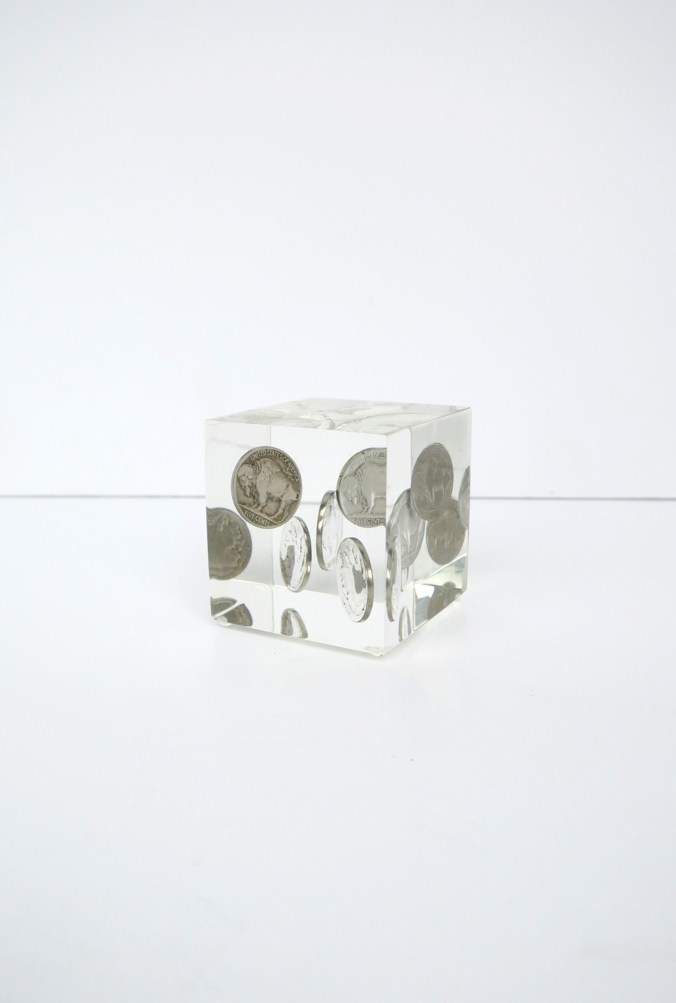 A Lucite cube, with Buffalo-Indian head nickel coins, desk paperweight or decorative object, circa late 20th century. Cube contains five 5-cent Buffalo Indian head coins with the following years: 1934, 1935, 1936, 1937 and 1938. A great piece for a