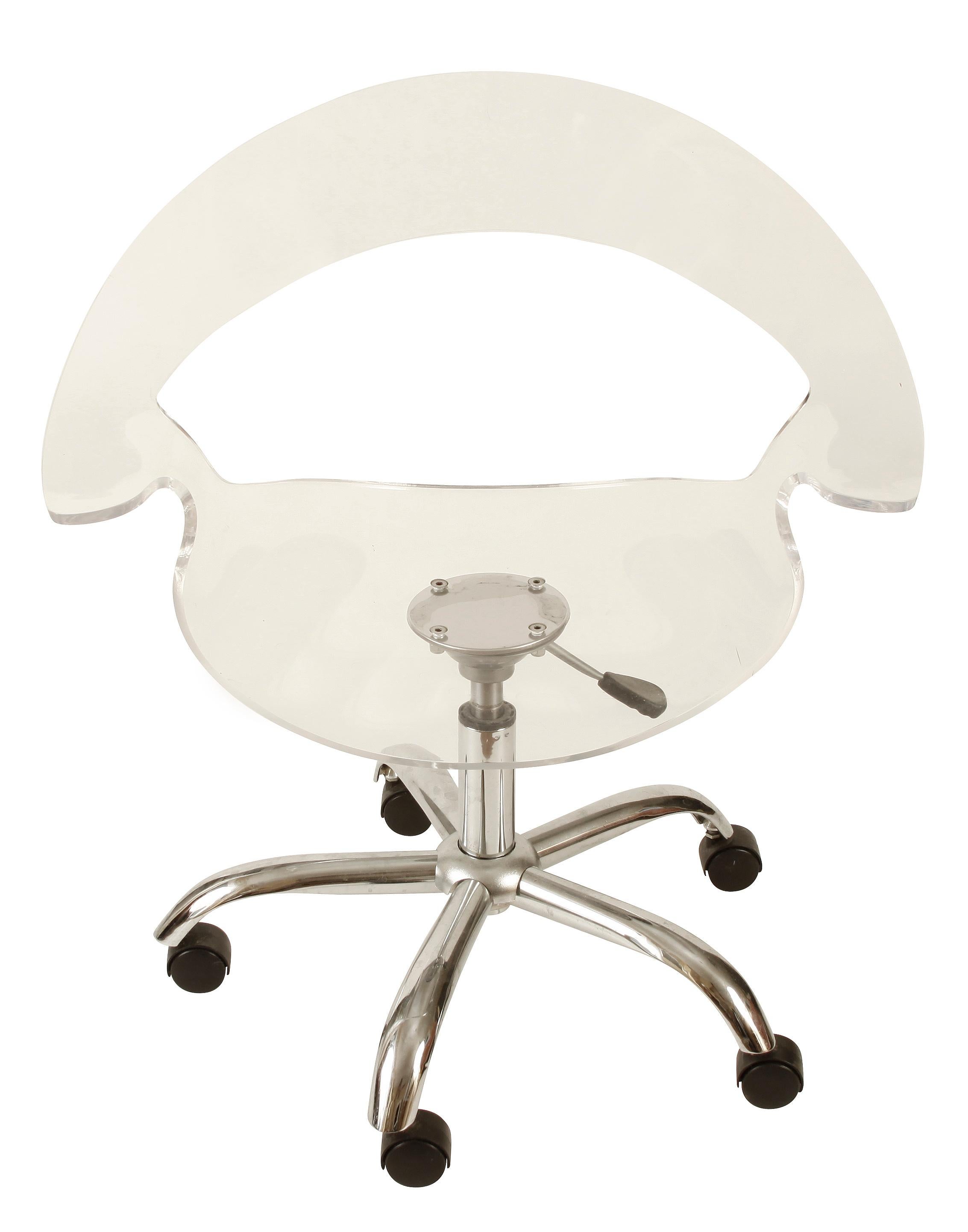 Lucite desk chair on chrome base with wheels. Adjustable height. Perfect for a desk or office.