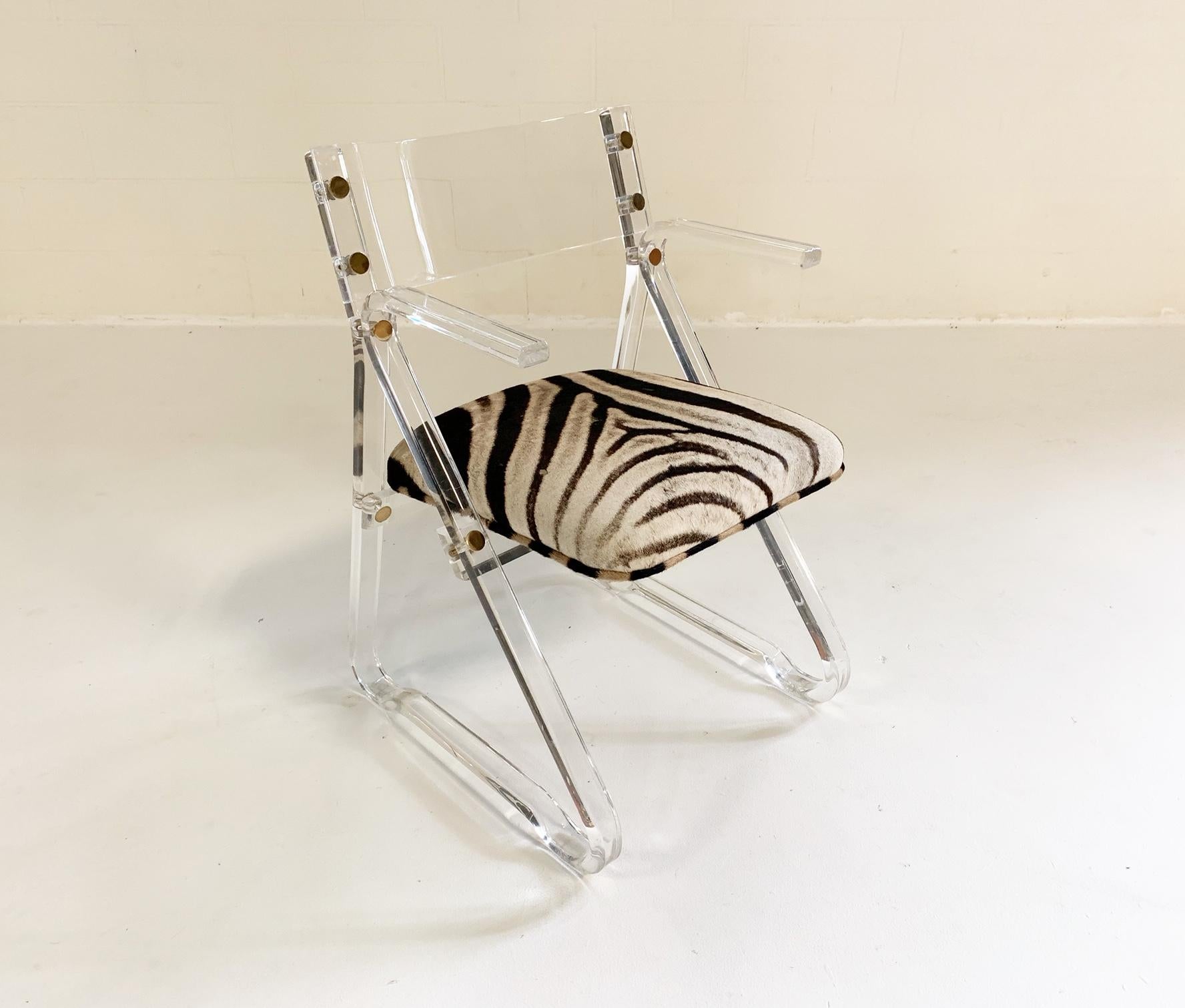 Lucite and zebra. What a cool look. This is the perfect desk or vanity chair. A smaller scale, with arms, So very chic.