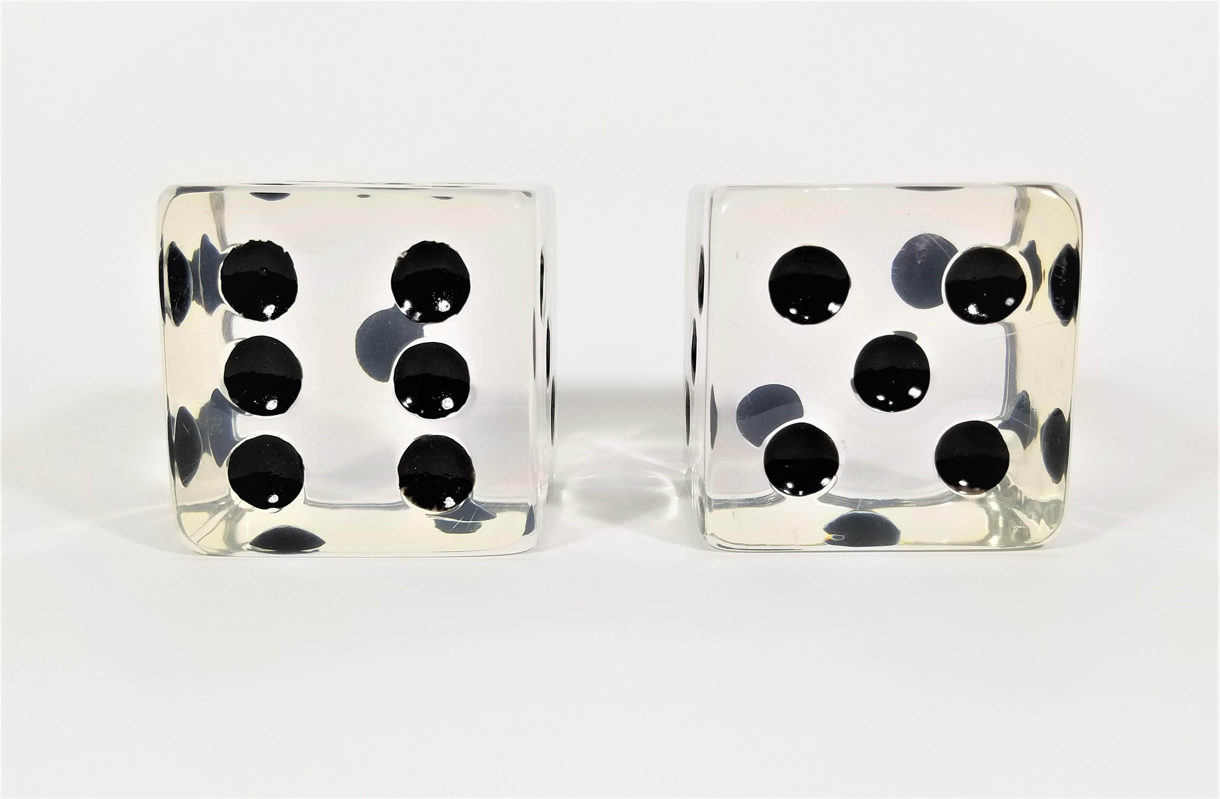 Pair of mid century 1960s solid lucite bookends. Large oversized dice with black dots.
By Charles Hollis Jones.
