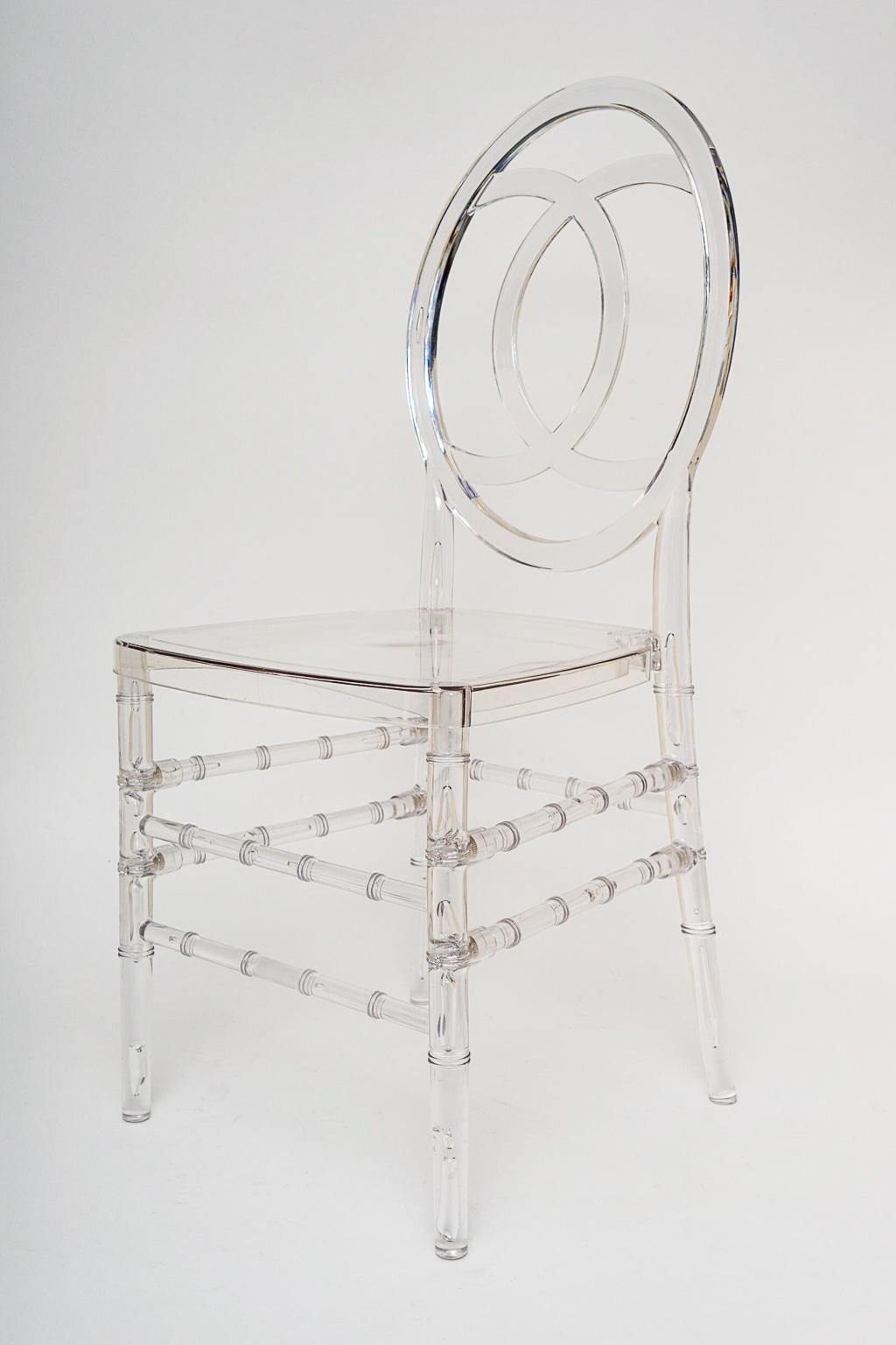 This stylish set of faux bamboo, Hollywood Regency inspired Lucite stacking chairs were acquired from a Palm Beach estate and they will make an understated and elegant statement at your next event. And of course they could be used on a daily basis