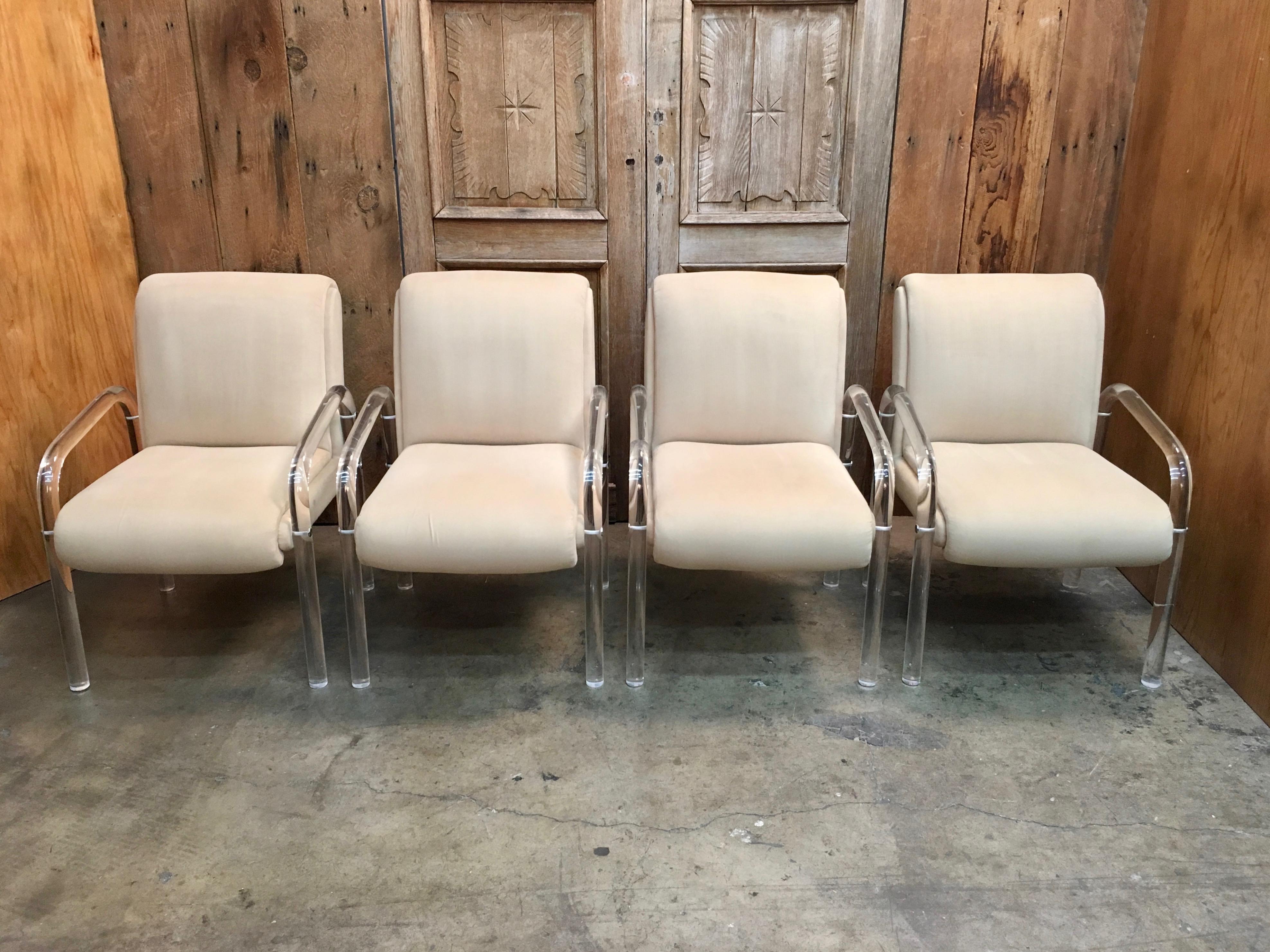 Set of four Lucite dining chairs attributed to lion and frost.