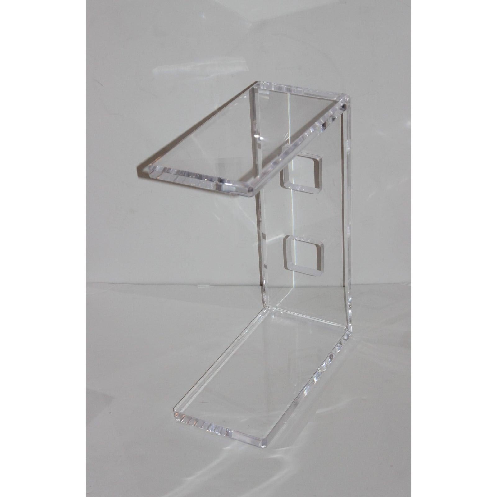 This stylish custom made lucite drinks table by Iconic Snob Galeries is the perfect size next to the sofa a club chair and with its open-end design the piece can be pulled up to the sofa as needed (see last image).

This is fashioned from 1 inch