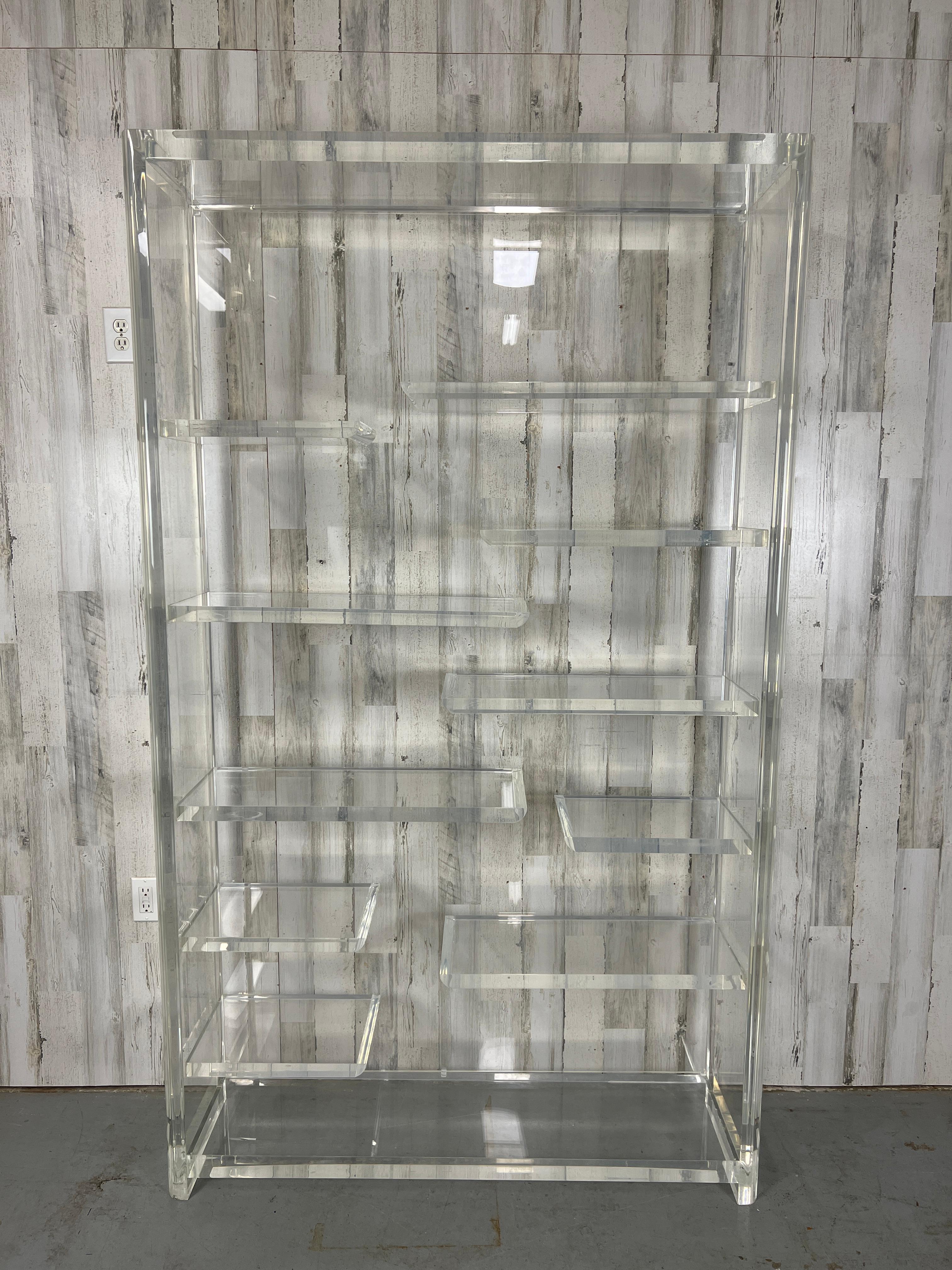 Lucite Multi Level Etagere. Thick transparent lucite shelf unit perfect for many books or small decor.