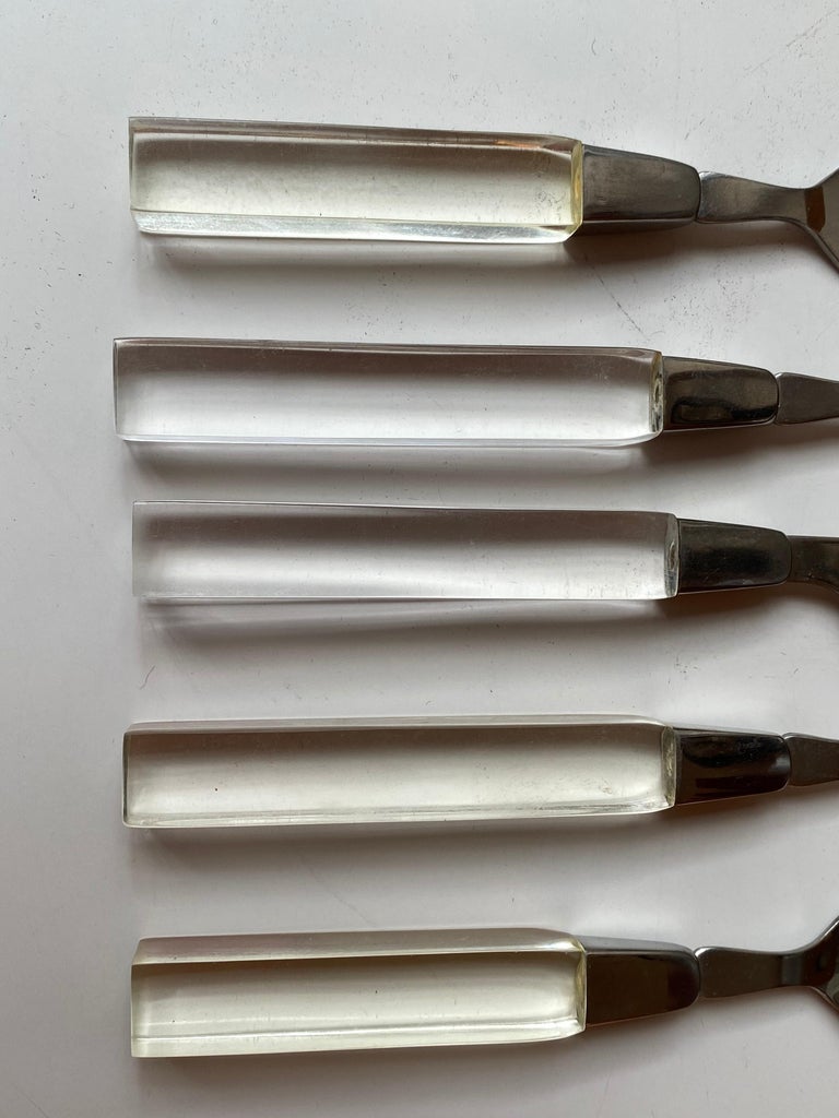 Lucite flatware set, service for 8 plus extras! Butter knife and sugar spoon included as well. 42 piece set plus extras! Lifetime cutlery, made in Taiwan. Set dates to the 1970's. Overall pretty clean with a couple handles showing discoloration.