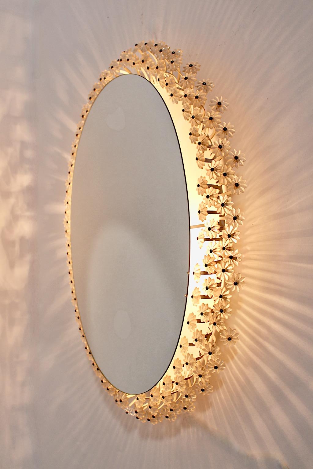 Mid-Century Modern vintage backlit oval wall mirror with many lucite flowers by Emil Stejnar 1950s Vienna.
This stunning wall mirror oval like from white lacquered metal features many lucite flowers and backlit.
Two E 14 sockets
Good condition