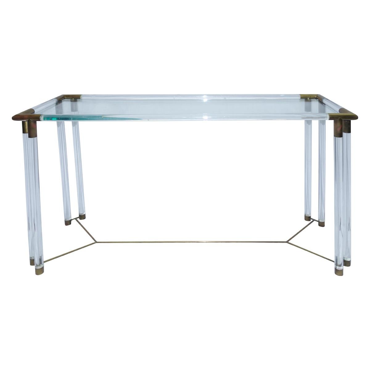 Elegant Regency style Lucite, glass and brass console table in the manner of Charles Hollis Jones.
Brass details and stretcher, glass top.
 
