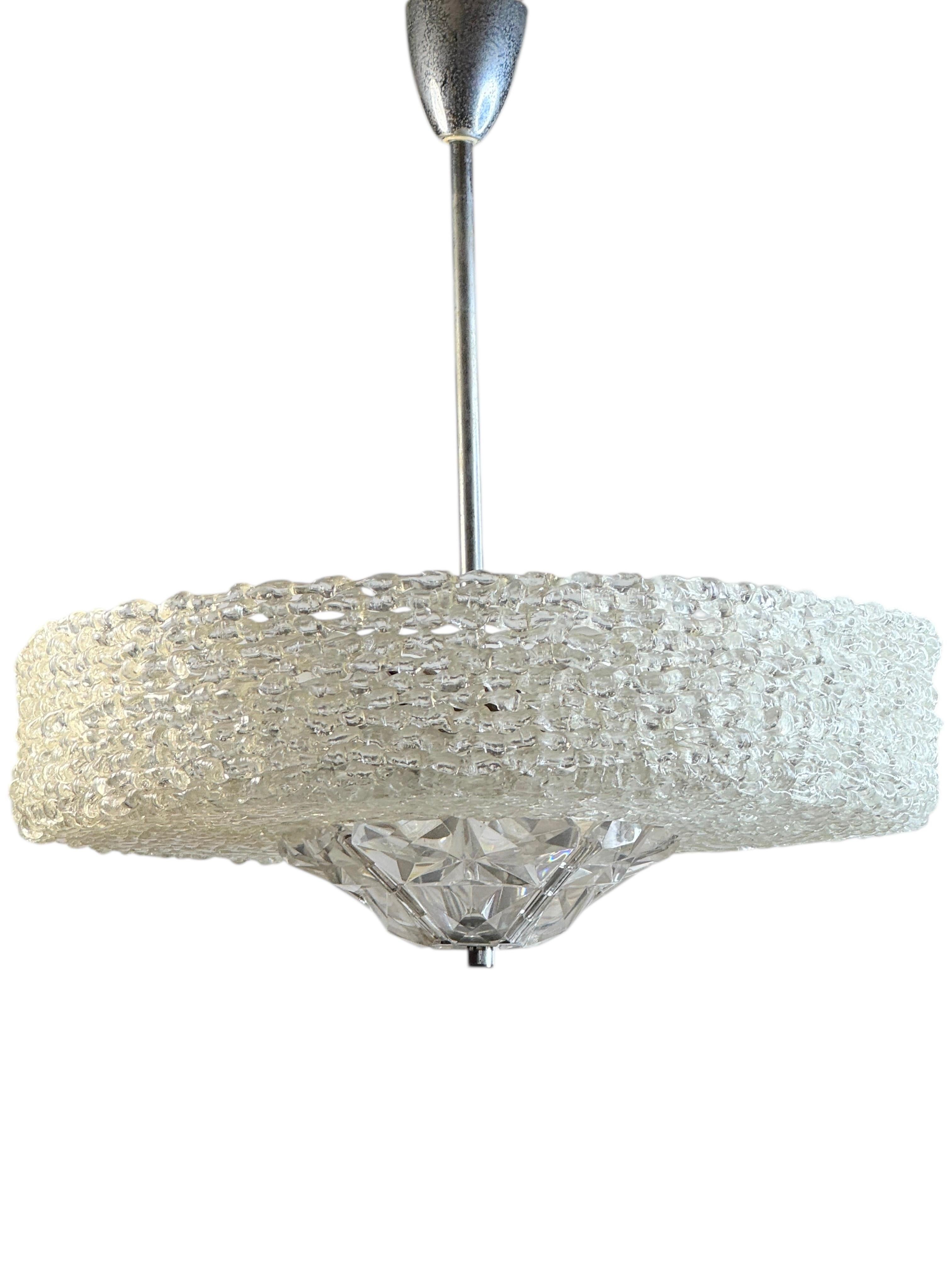 Beautiful chandelier or pendant light by Austrolux. An original mid-century vintage piece manufactured in the 1960s. It is made of metal and lucite. The Fixture requires six European E27 / 110 Volt Edison bulbs, each bulb up to 60 watts. It comes