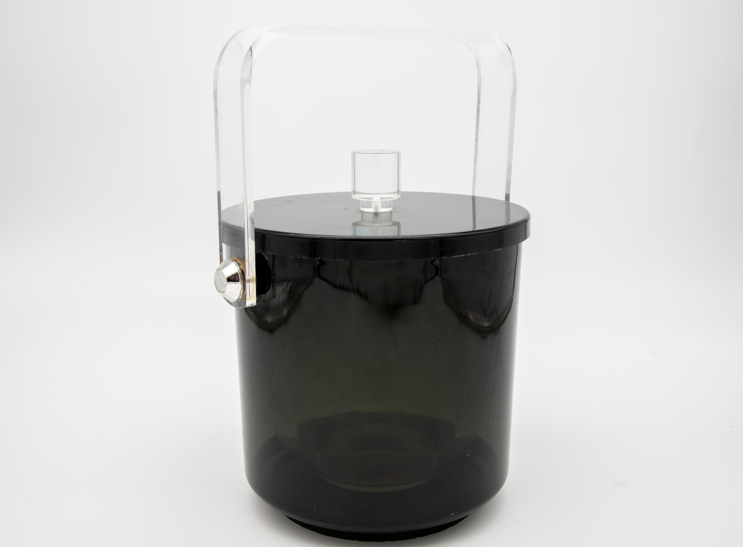 Black mid century lucite ice bucket with clear handle and knob.