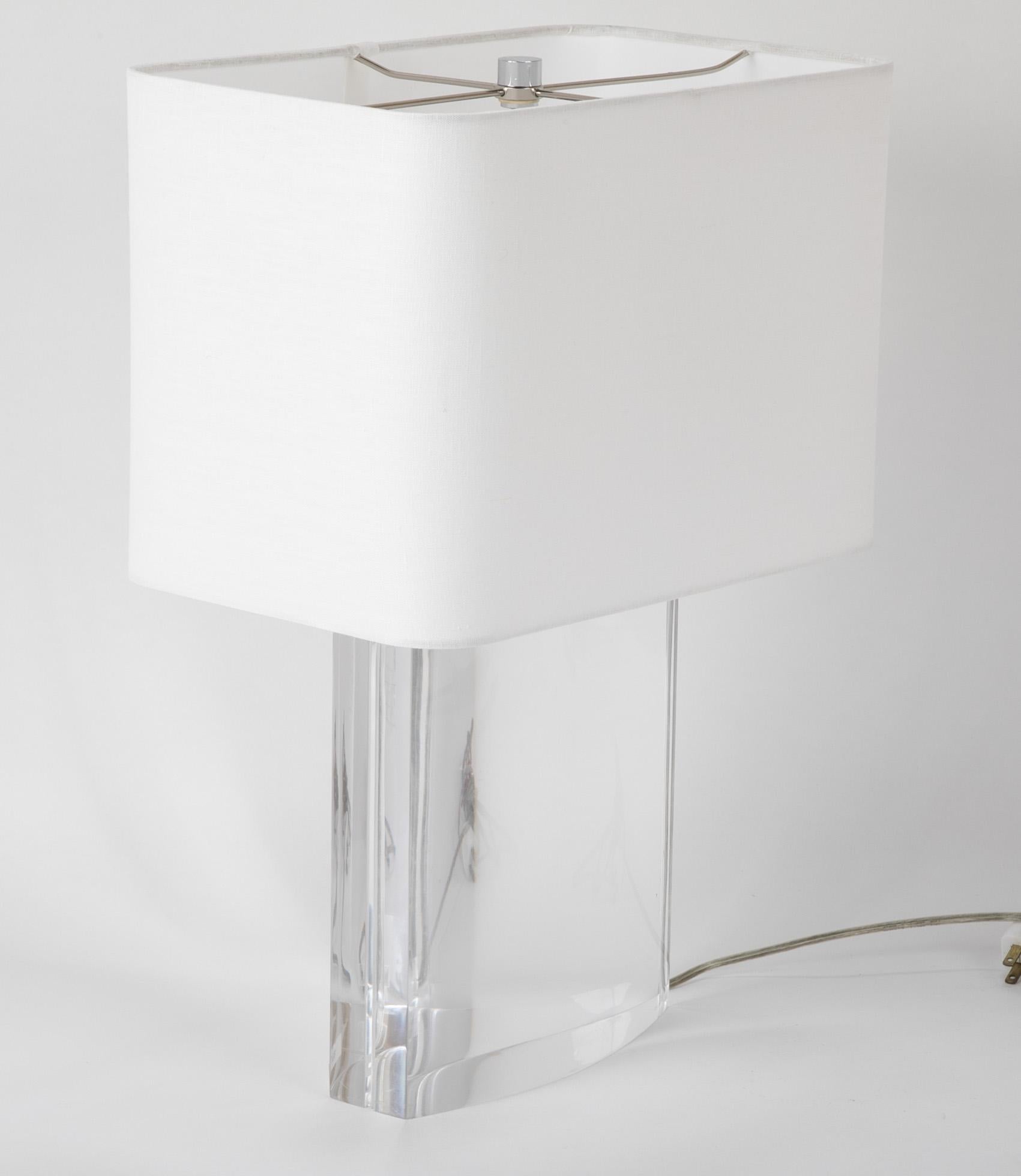A beautiful Lucite table lamp in the style of Karl Springer.
