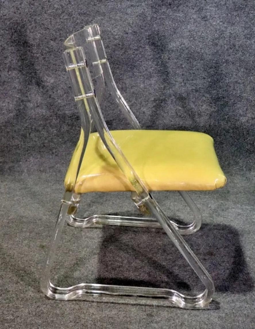 Mid-century modern desk chair with clear lucite frame and leather cushion. 
Please confirm location NY or NJ
