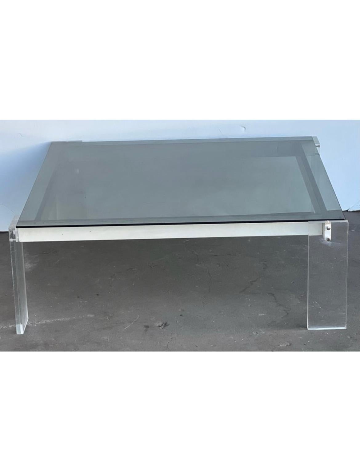 Here is a really unique imported Italian Lucite and glass Mid-Century Modern coffee table. The glass top lifts and can be removed to replace with something else if one chooses. There are 4 white sides that help support the glass top that features 4