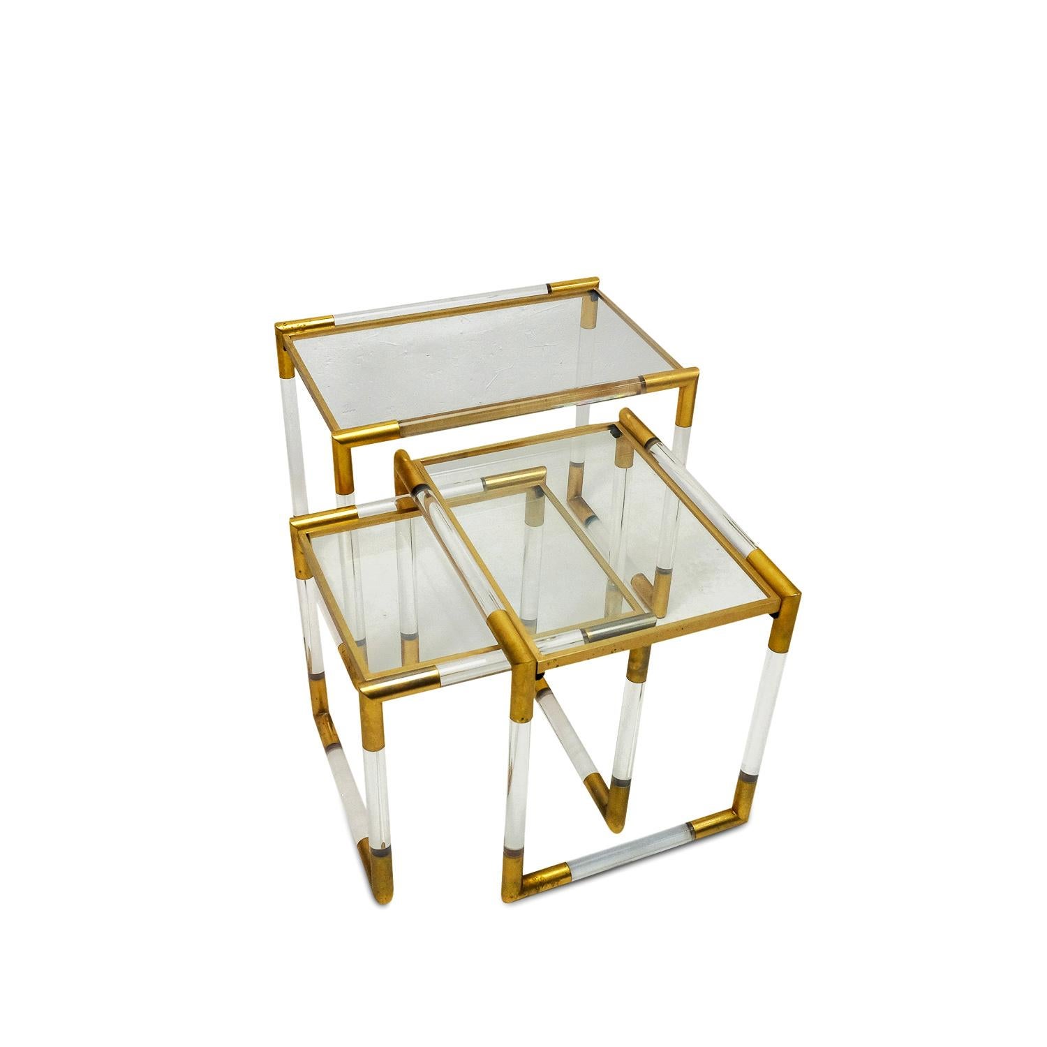 Set of nesting tables by Charles Hollis Jones, a US furniture designer who uses acryl, lucite and brass in his works to create translucent furniture with polished bronze and chrome highlights. His designs have seen a steady following over the years,