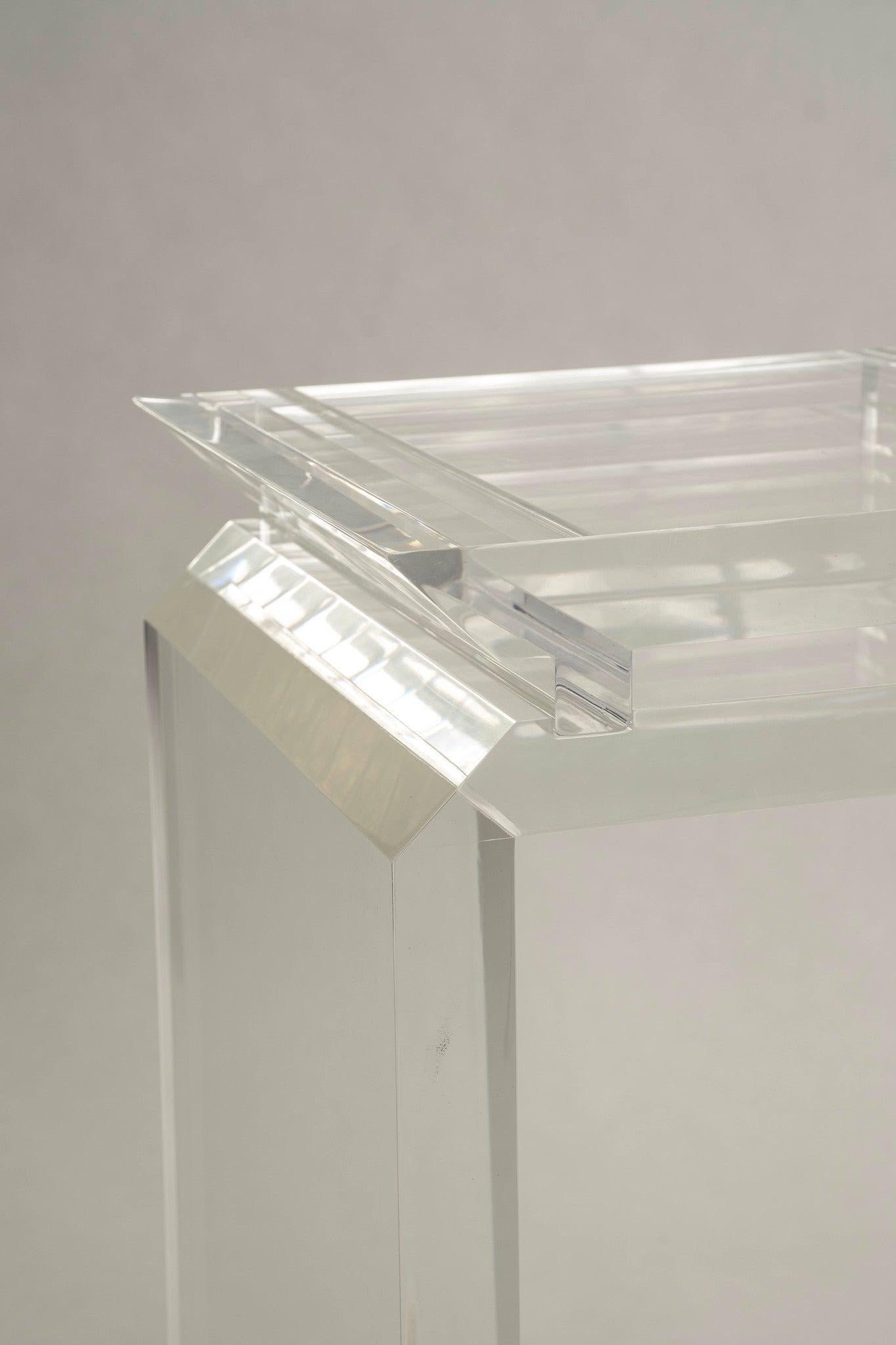 Late 20th Century lucite pedestal featuring a raised beveled top.