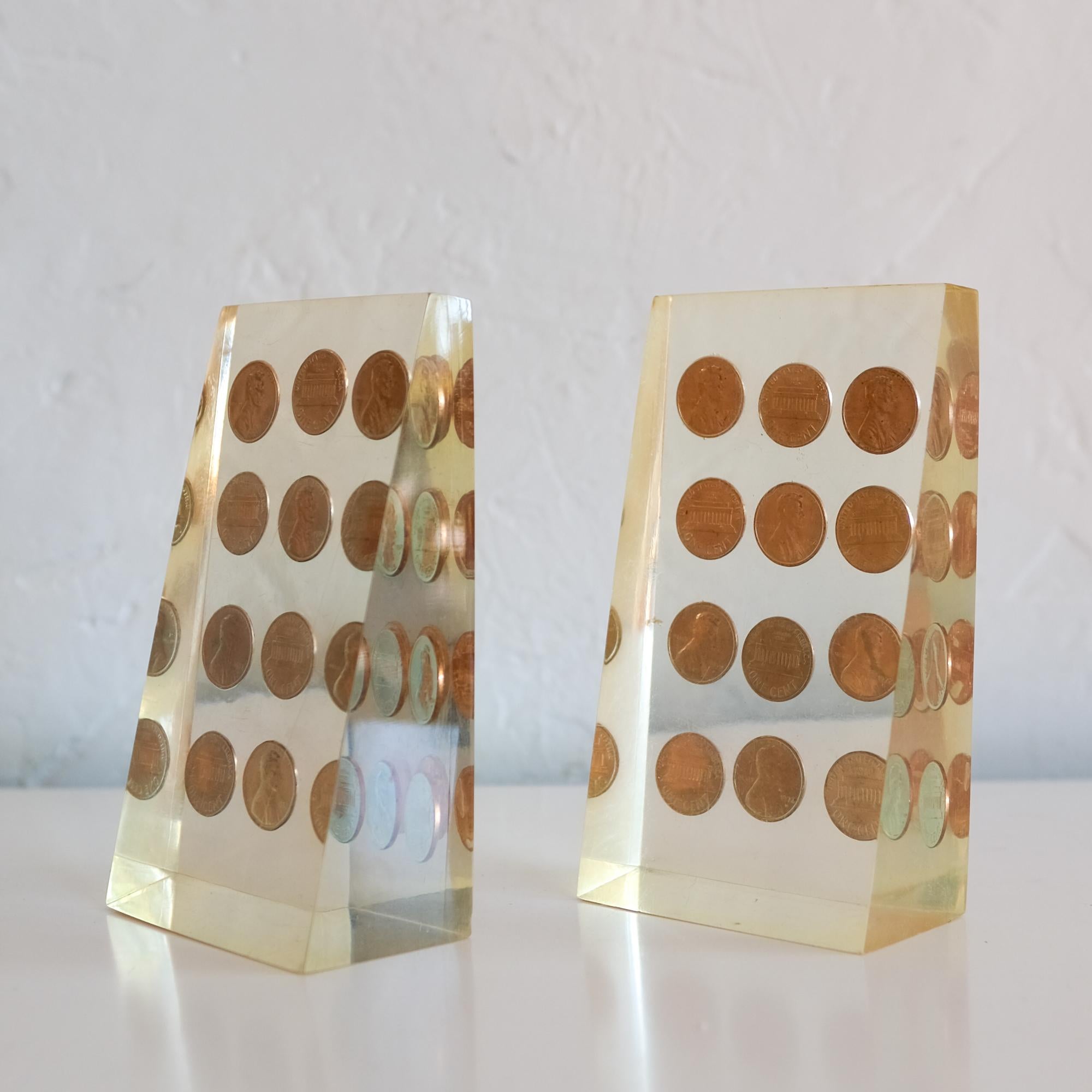 A lucky pair of Lucite encased 1972 penny bookends.