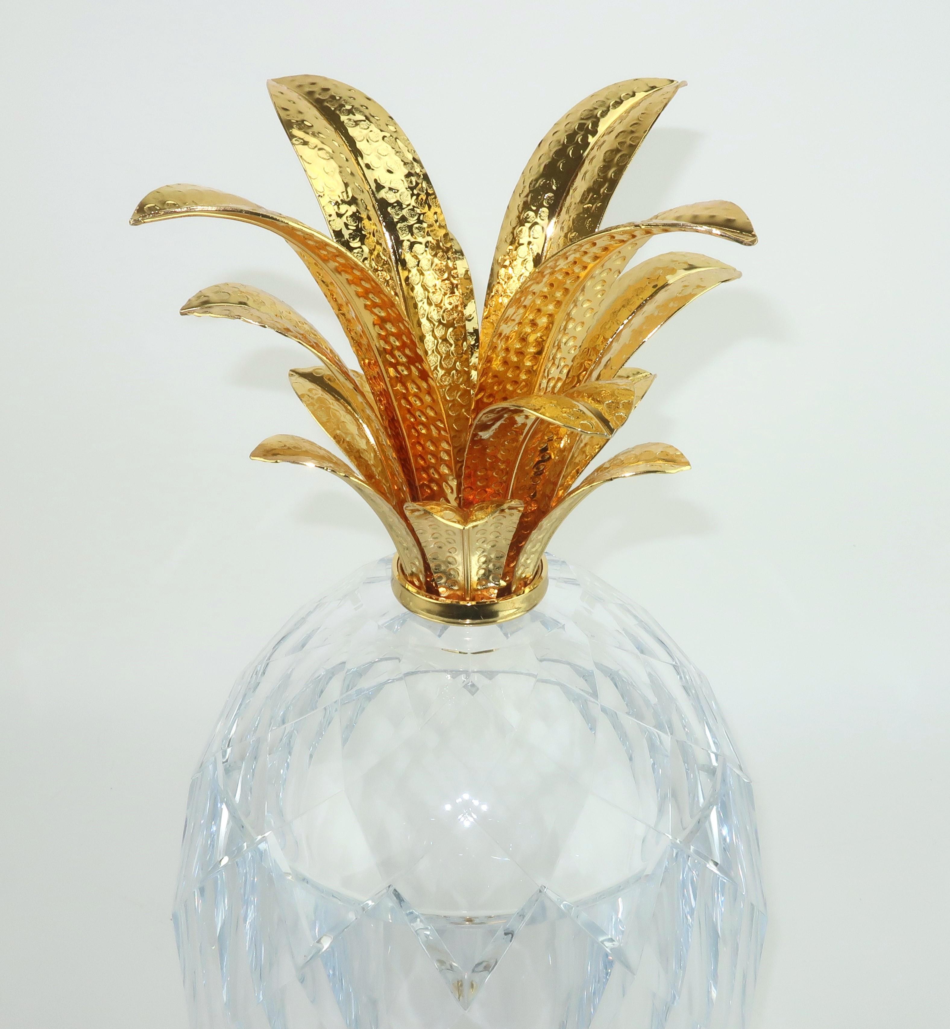 Ultra glam clear acrylic ice bucket with gold plated fronds perfect for a Hollywood Regency decor or any setting with a tropical vibe. Beautifully made with faceting that reflects the light and quality details including a weighty base and textured