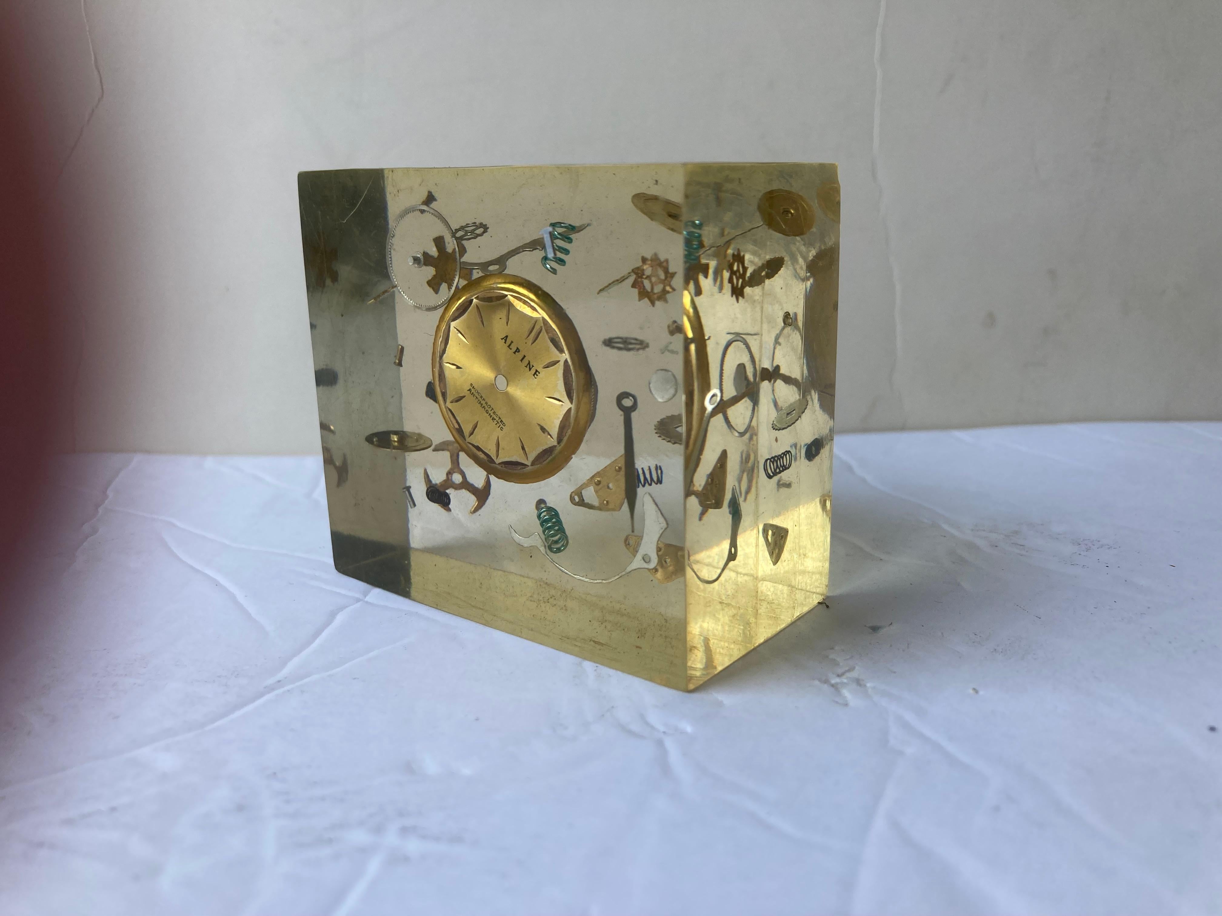 Beautiful sculpture in resin with clock parts inside.