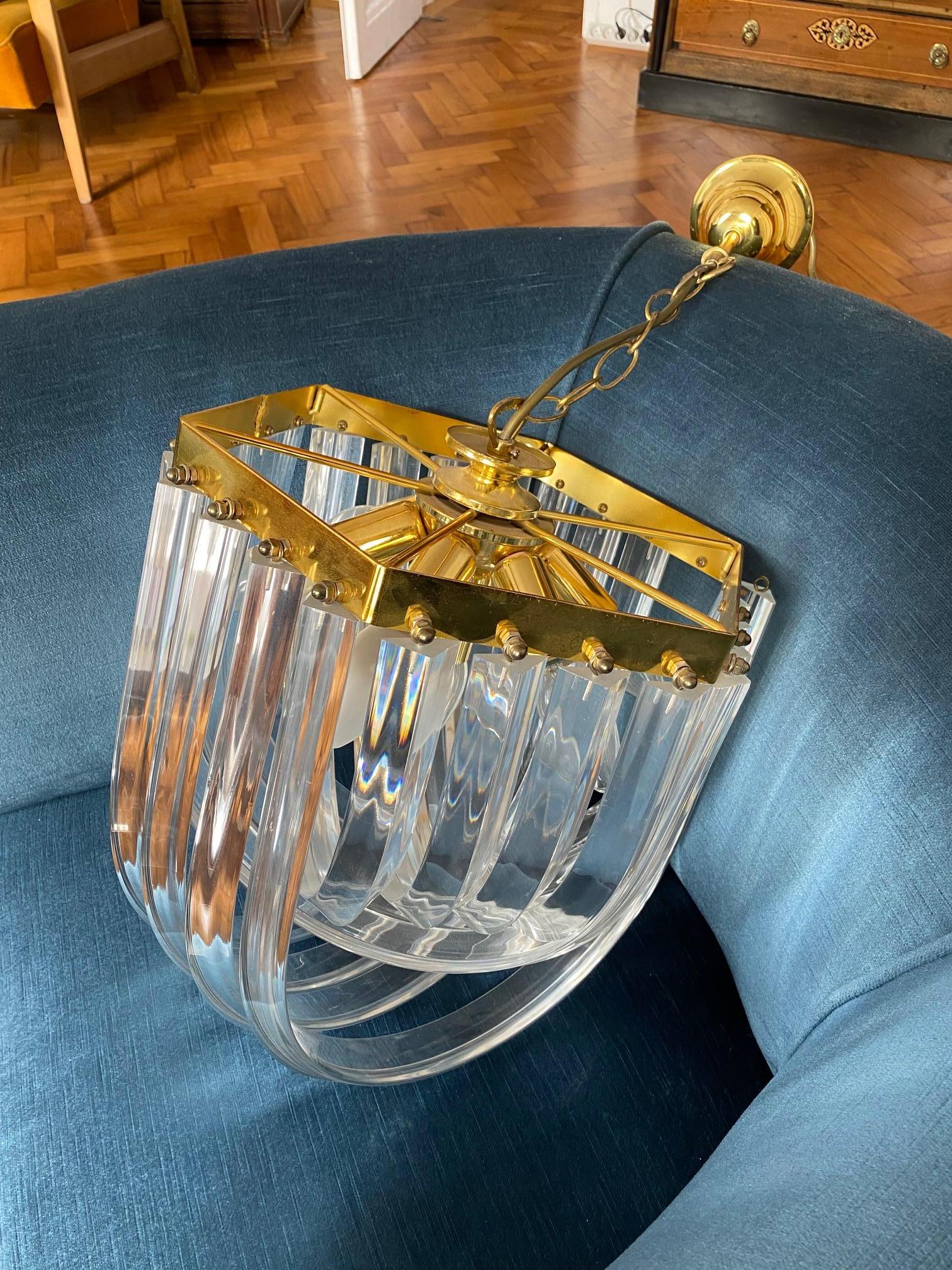 Mid-century clear Lucite ribbon swag prism chandelier, in the style of Carlo Nason or Triedri. This beautiful curved chandelier features pieces of curved Lucite or acrylic rods suspended in alternate intertwining loops to 
 a square hexagonal shape