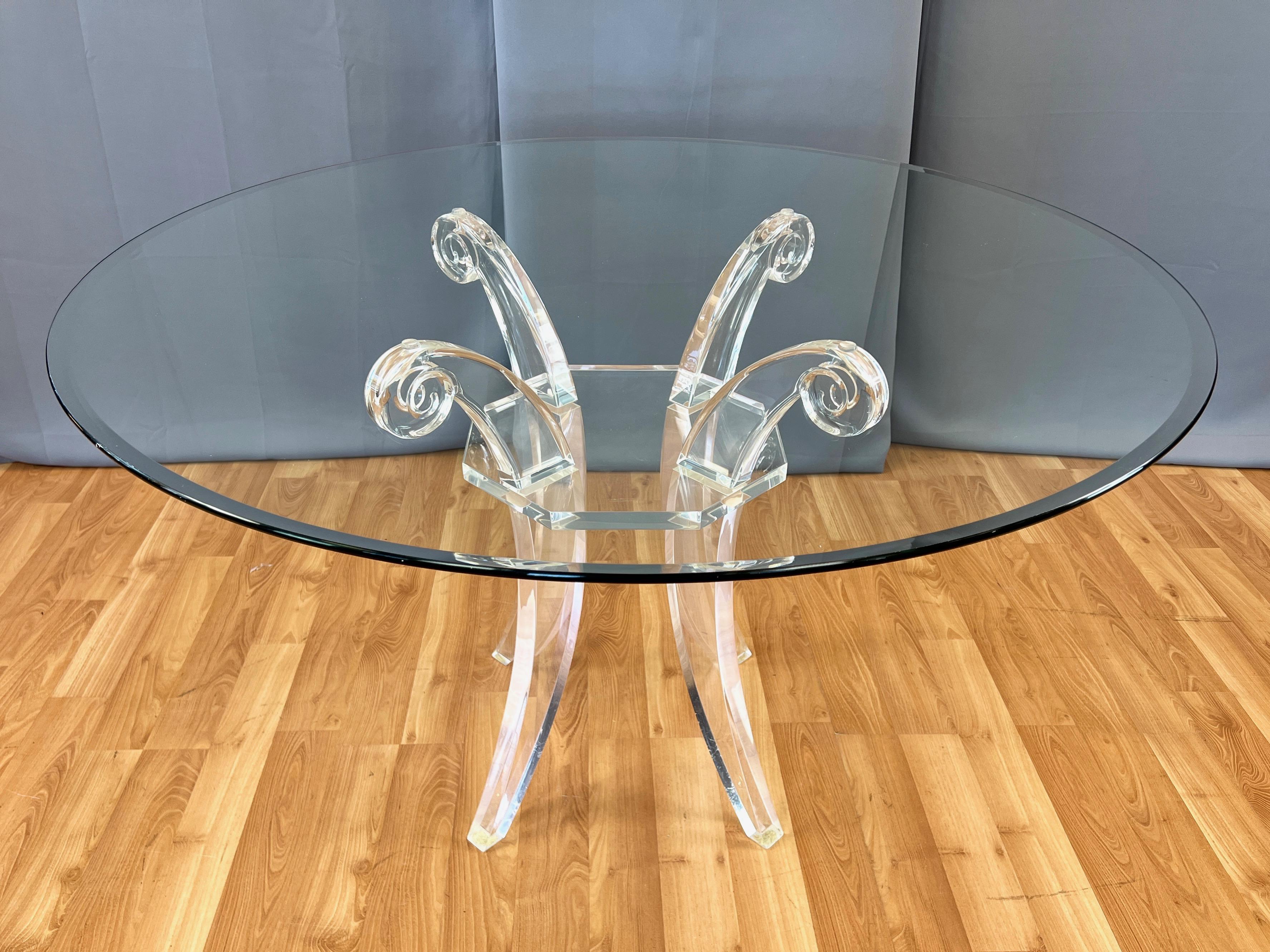 Hollywood Regency Lucite Saber Leg Scroll-Motif Dining Table with Round Glass Top, circa 1980