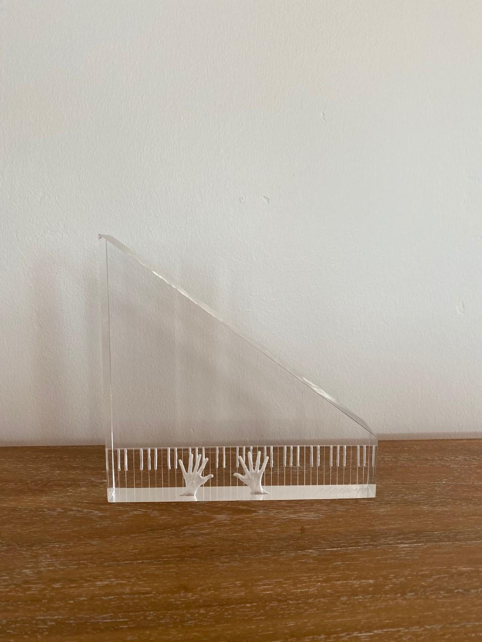 Lucite piano and hands sculpture, circa 1980s. Similar style to Eugene Brignola exquisite details.
Measures: 8” long, 8” tall, 1.5” wide signed by artist (Joseph Galvan).
     