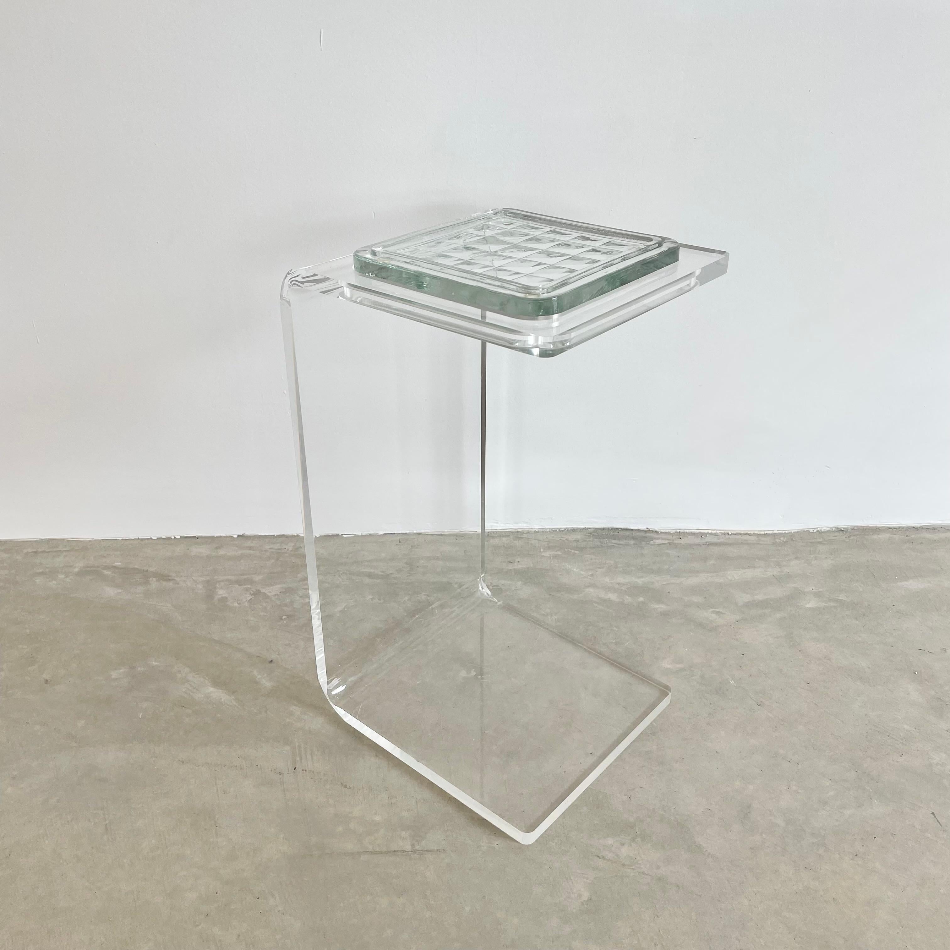C-shaped lucite end/side table with removable glass tile marked ‘Made in W Germany’, circa 1990. A gorgeous, subtle and multifunctional accent piece that would work seamlessly in any room as side table, catchall, drink table or even as a nightstand.
