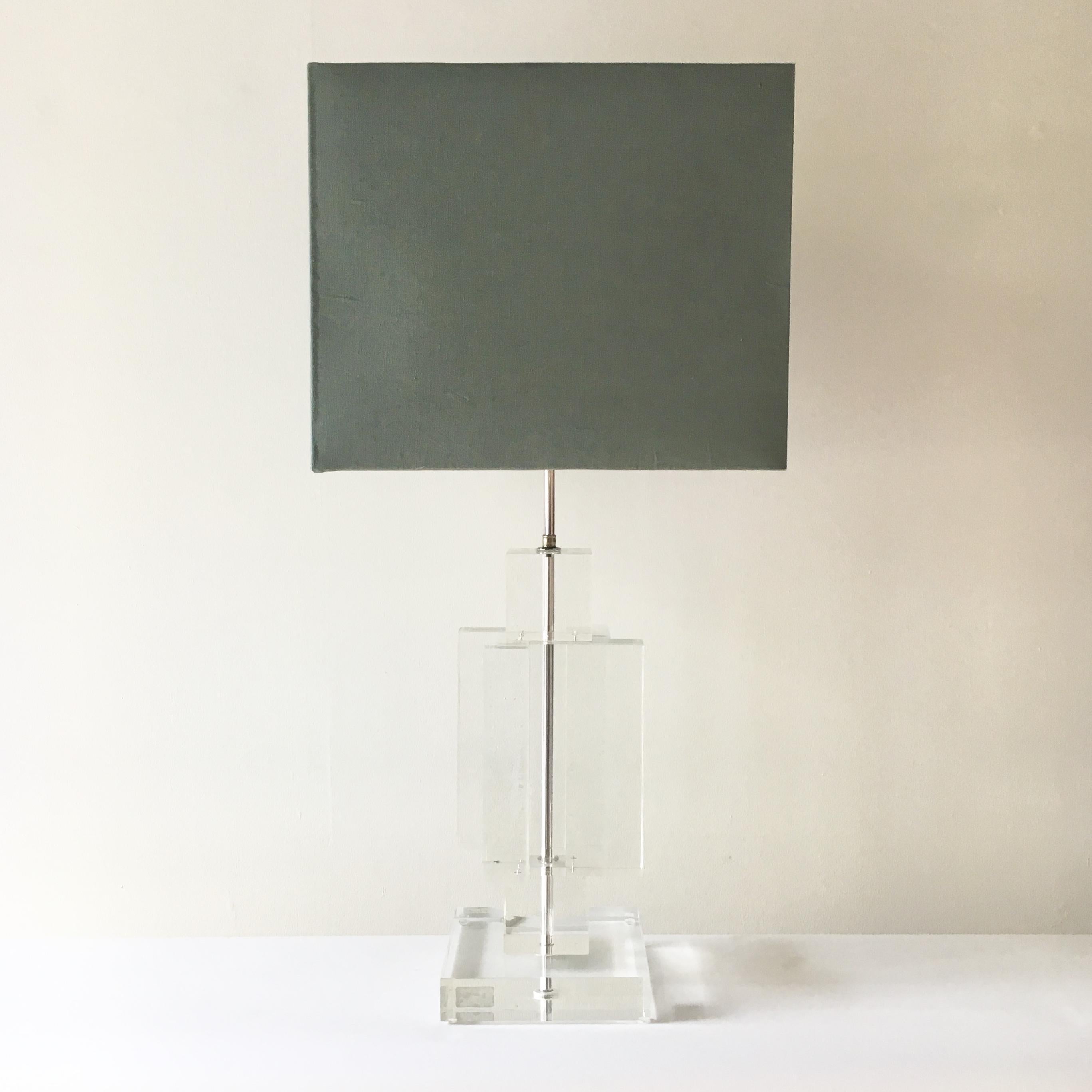 Monumental Lucite skyscraper table lamp with nickel stem designed and manufactured in France by 'Les Prismatique' and accompanied with Talisman's fabric shade.
Makers mark stamped to the nickel on top of the Lucite.