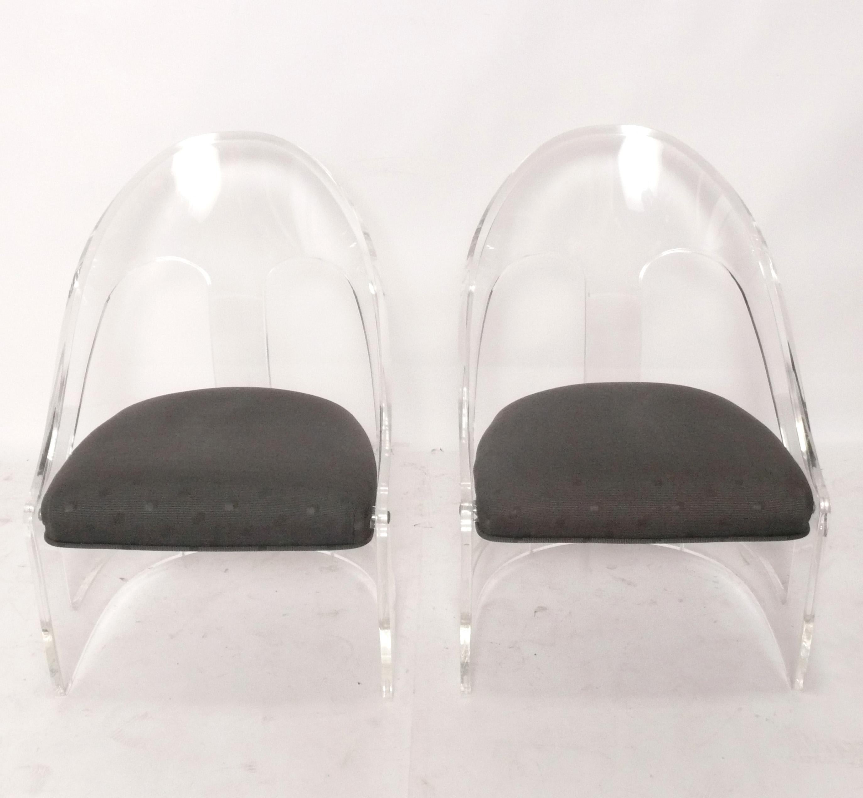 Pair of Sculptural Lucite Lounge Chairs, American, circa 1960s. These chairs are currently being reupholstered and can be completed in your fabric at no additional charge. Just send us three yards of your fabric after purchase. 
