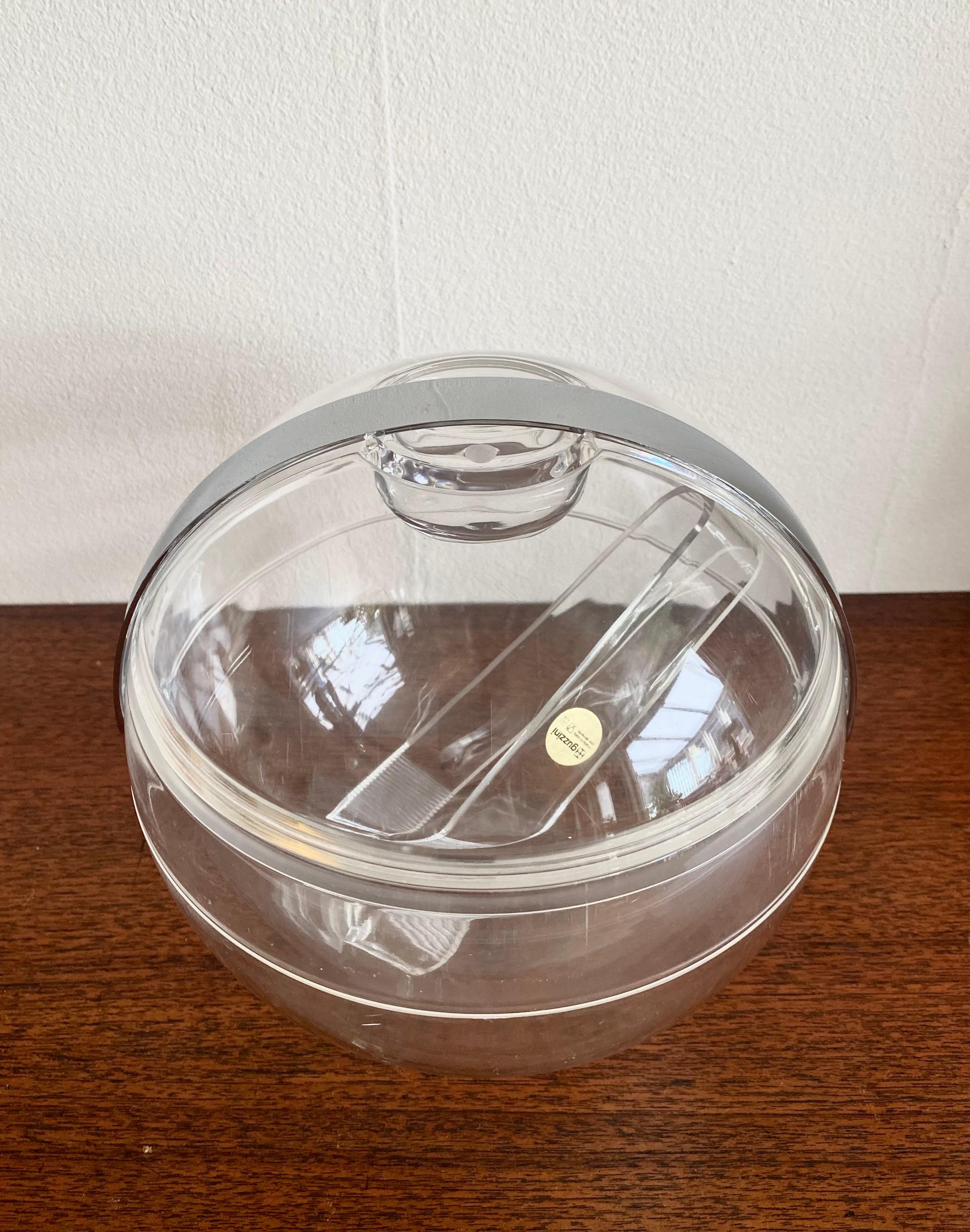 Clear Lucite icebucket, Model Stella, by Pablo Tilche for Guzzini Itali ca. 1970s. The piece remains in good vintage condition with some wear and corrosion of water (see:images). If you are interested in this item, feel free to make us a reasonable