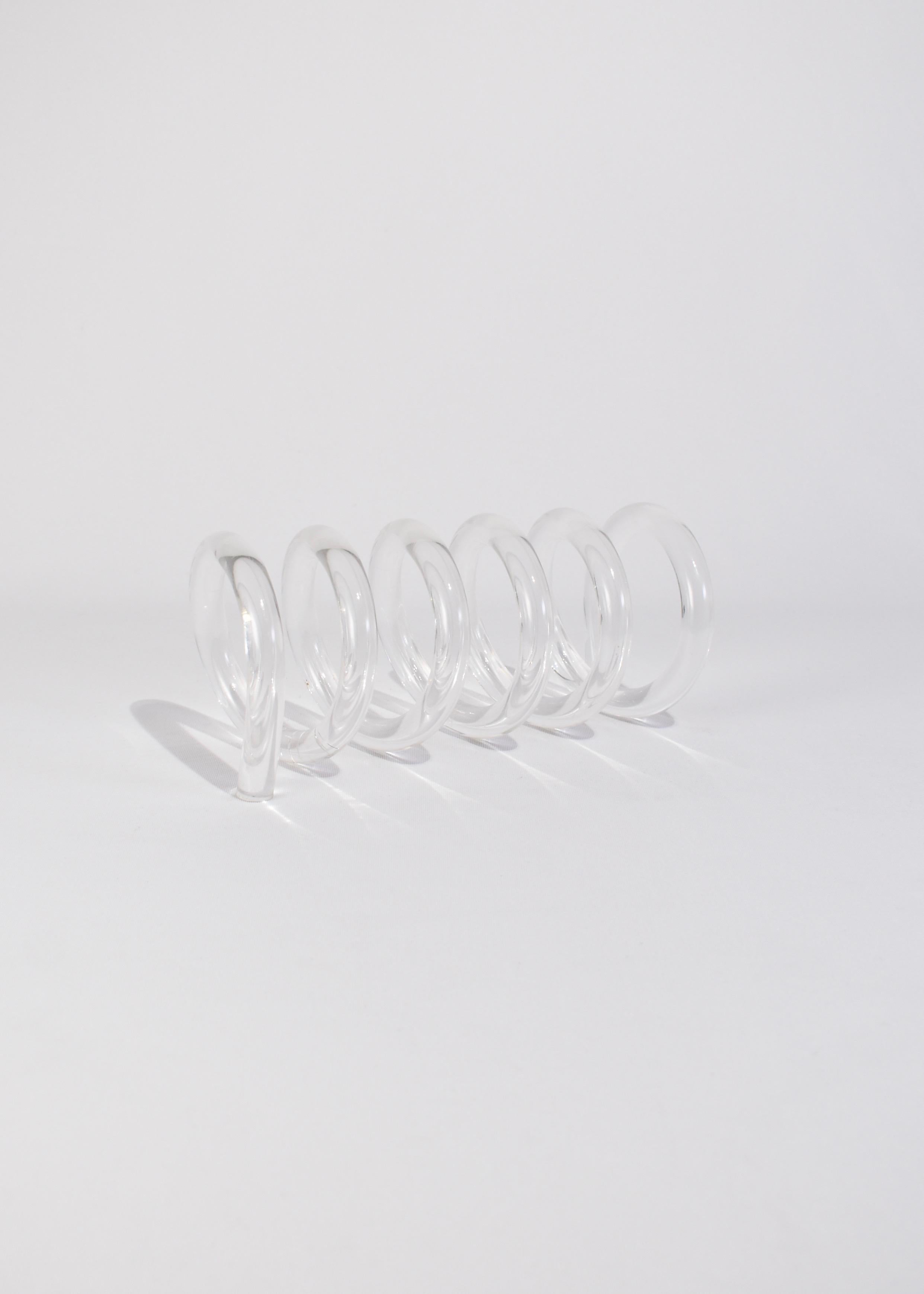 Beautiful vintage lucite spiral sculpture by Dorothy Thorpe. May be displayed standing as a sculptural piece or lying as an organizer for letters.