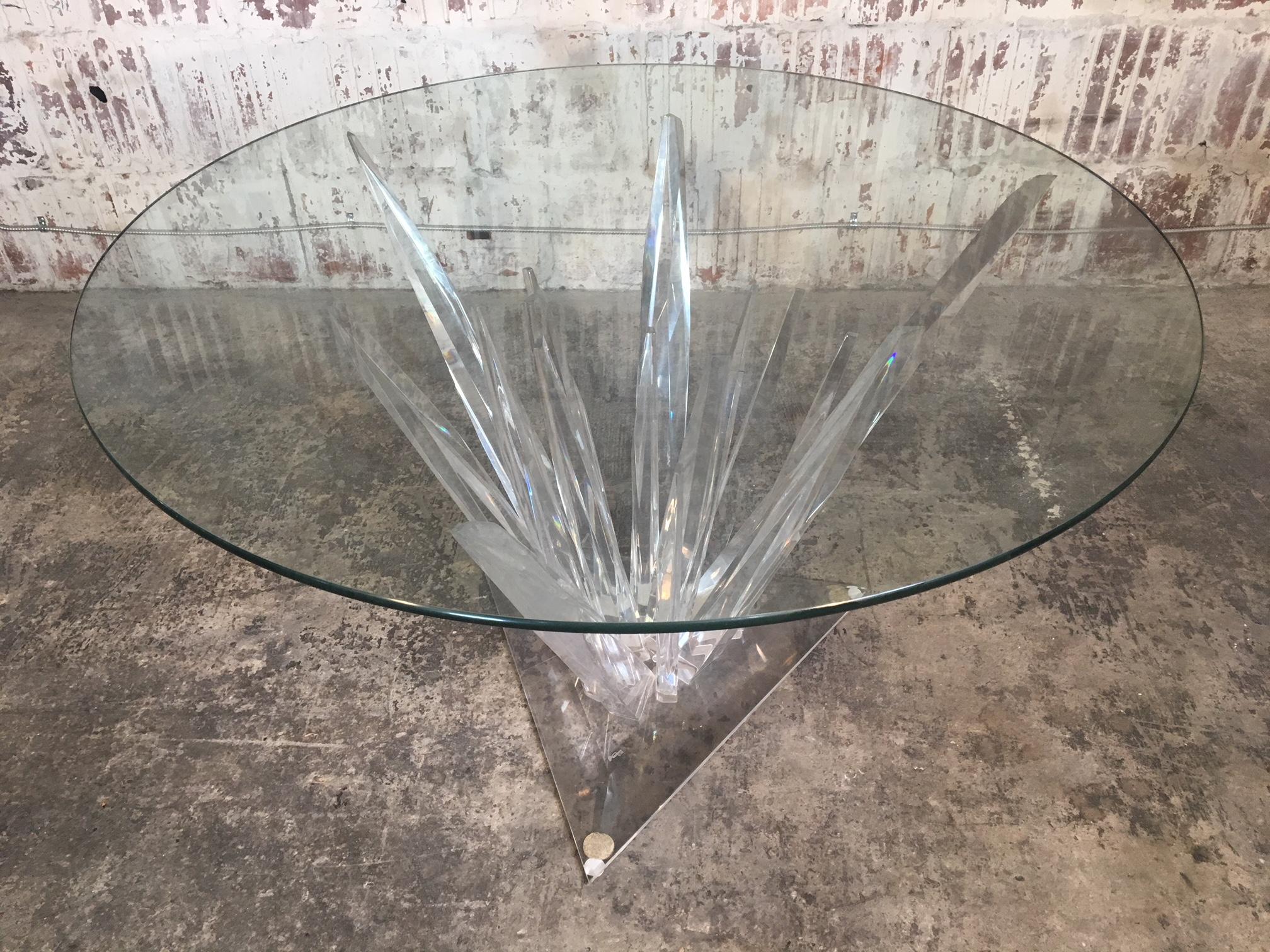 Sculptural Lucite dining table mimicking stalagmites with glass top, circa 1979. Lucite in excellent condition, free from scratches or discoloration. Glass top has surface scratches. Definite statement piece. Glass measures 48