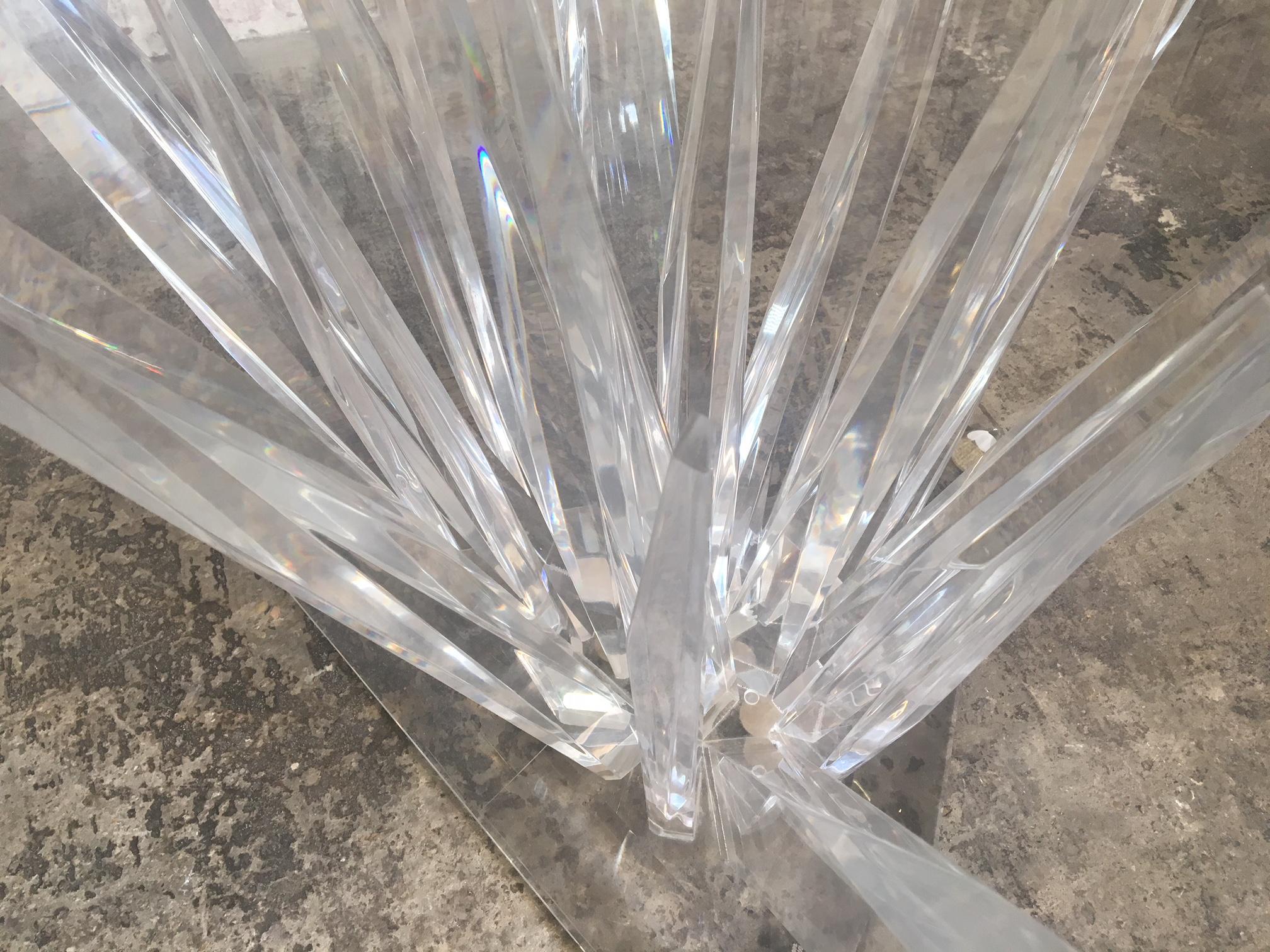 Sculptural Lucite dining table mimicking stalagmites with glass top, circa 1979. Lucite in very good condition, free from scratches or discoloration. Glass top has surface scratches. Definite statement piece. Glass measures 48